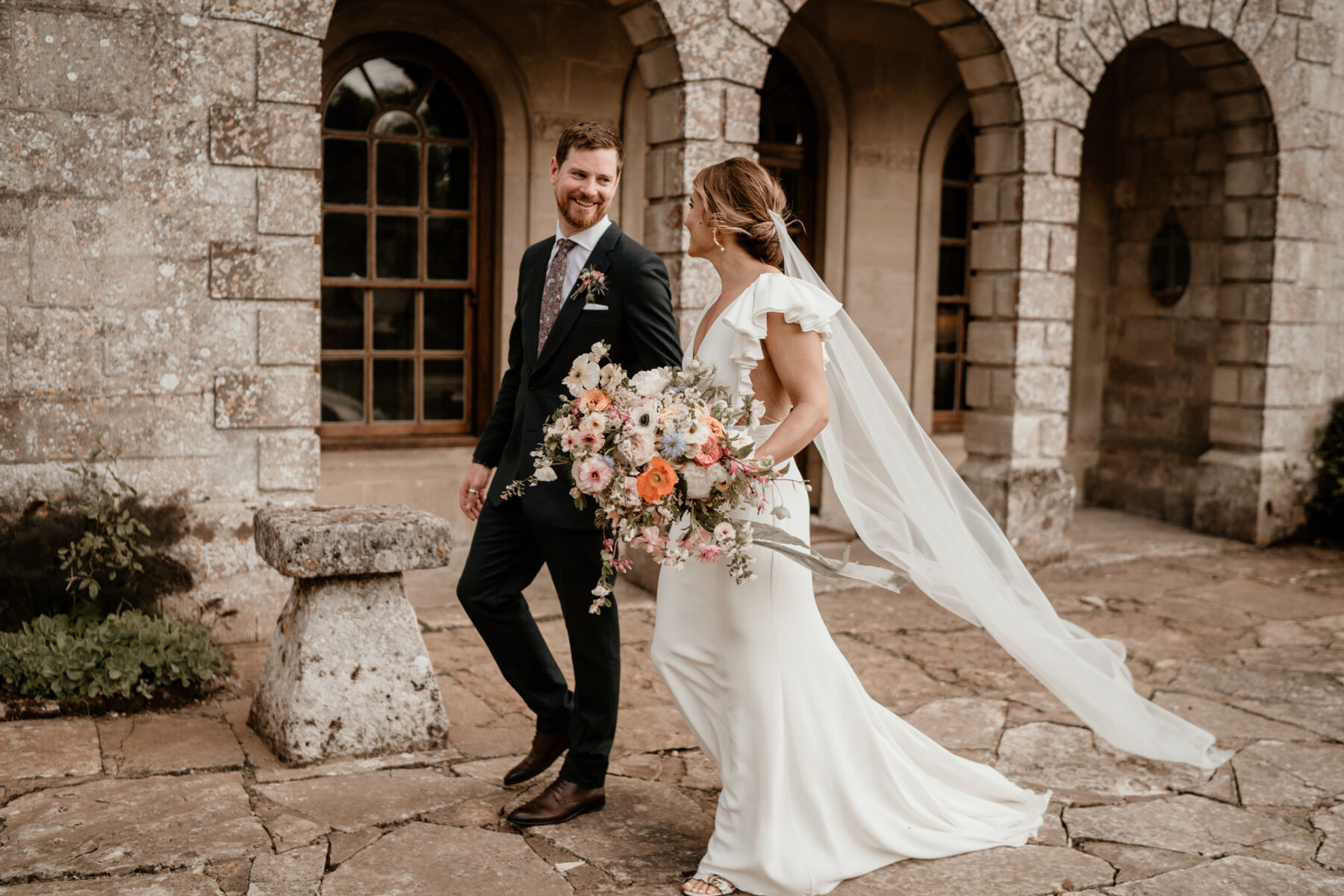 Alexandra Grecco bride carrying a beautiful oversized Spring wedding bouquet