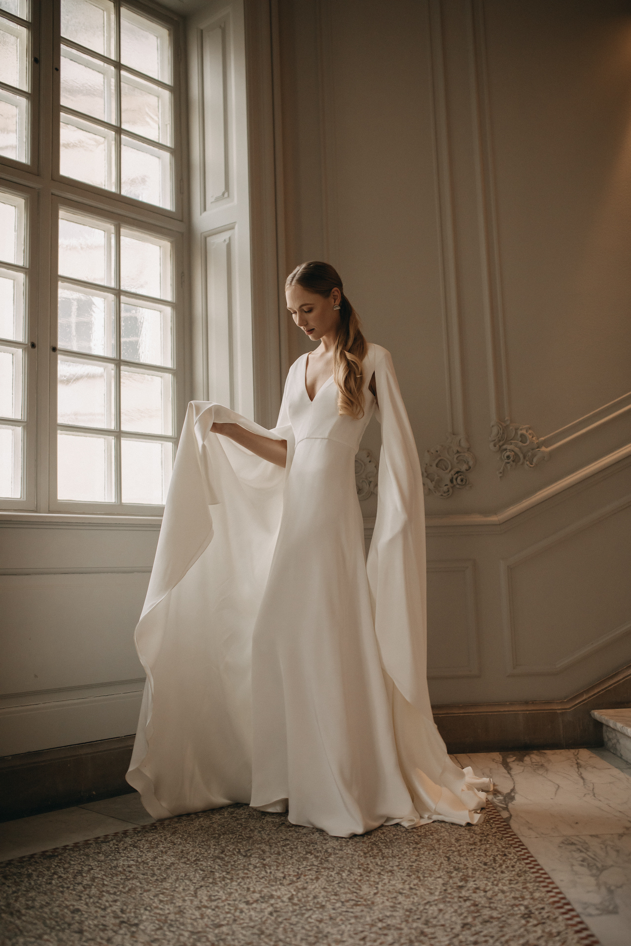 Andrea Hawkes bridal wedding dress with sleeve wings.