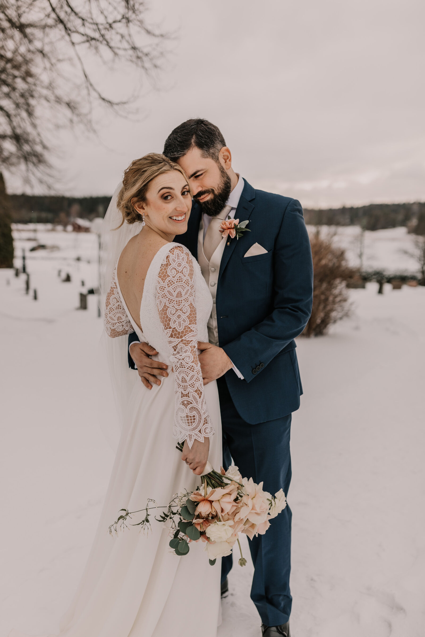 Andrea Hawkes Bridal wedding dress with lace sleeves.