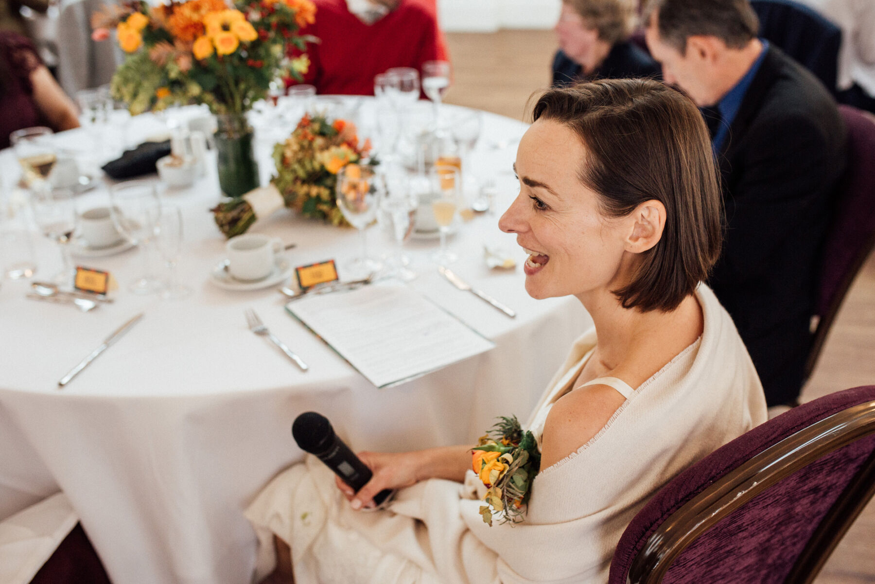 Lucy, in her Gran's 1950's Wedding Dress for her Autumn Wedding at Barton Hall 39 Bride with a microphone ready to do a speech at her wedding.