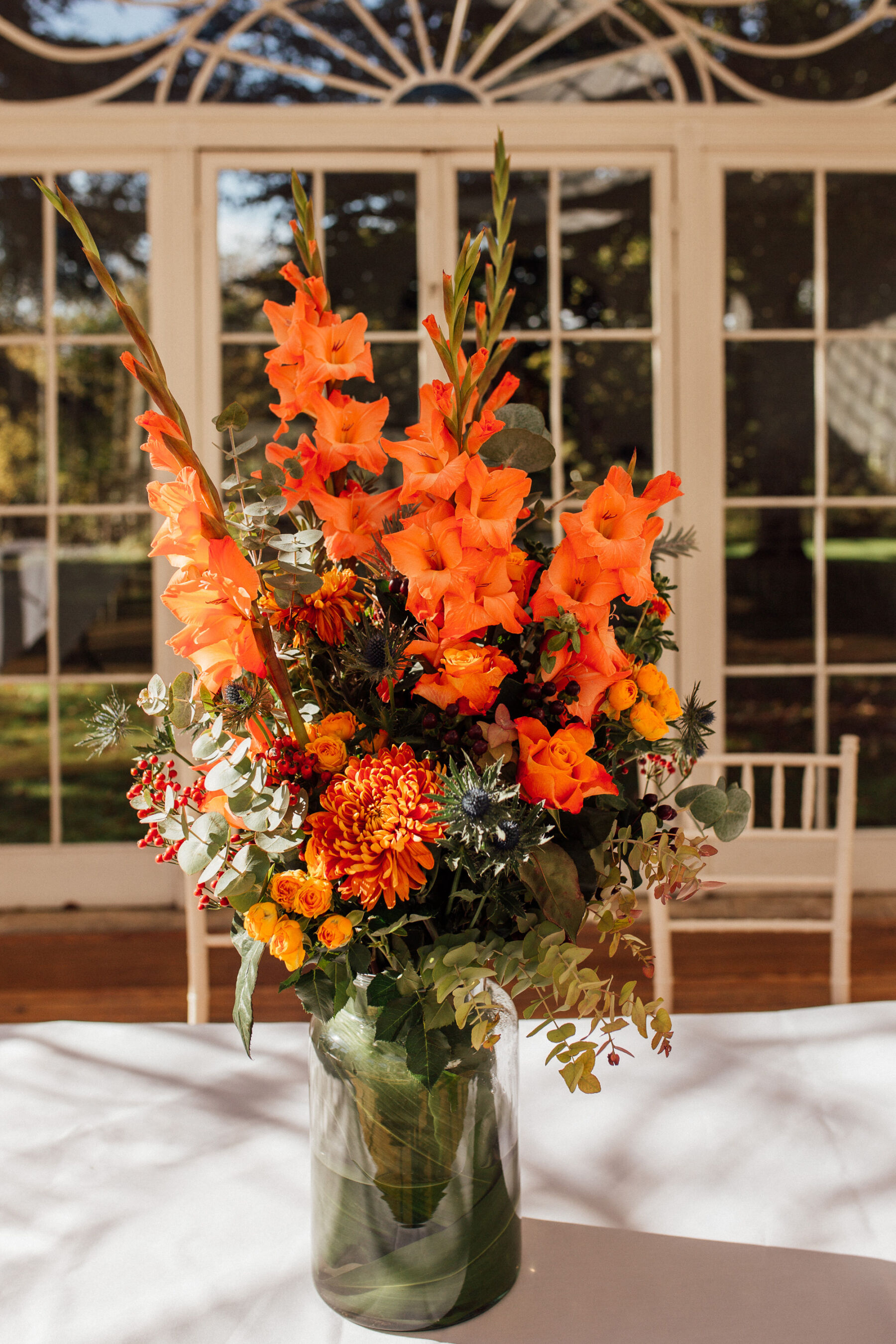 Lucy, in her Gran's 1950's Wedding Dress for her Autumn Wedding at Barton Hall 38 Orange wedding flowers.