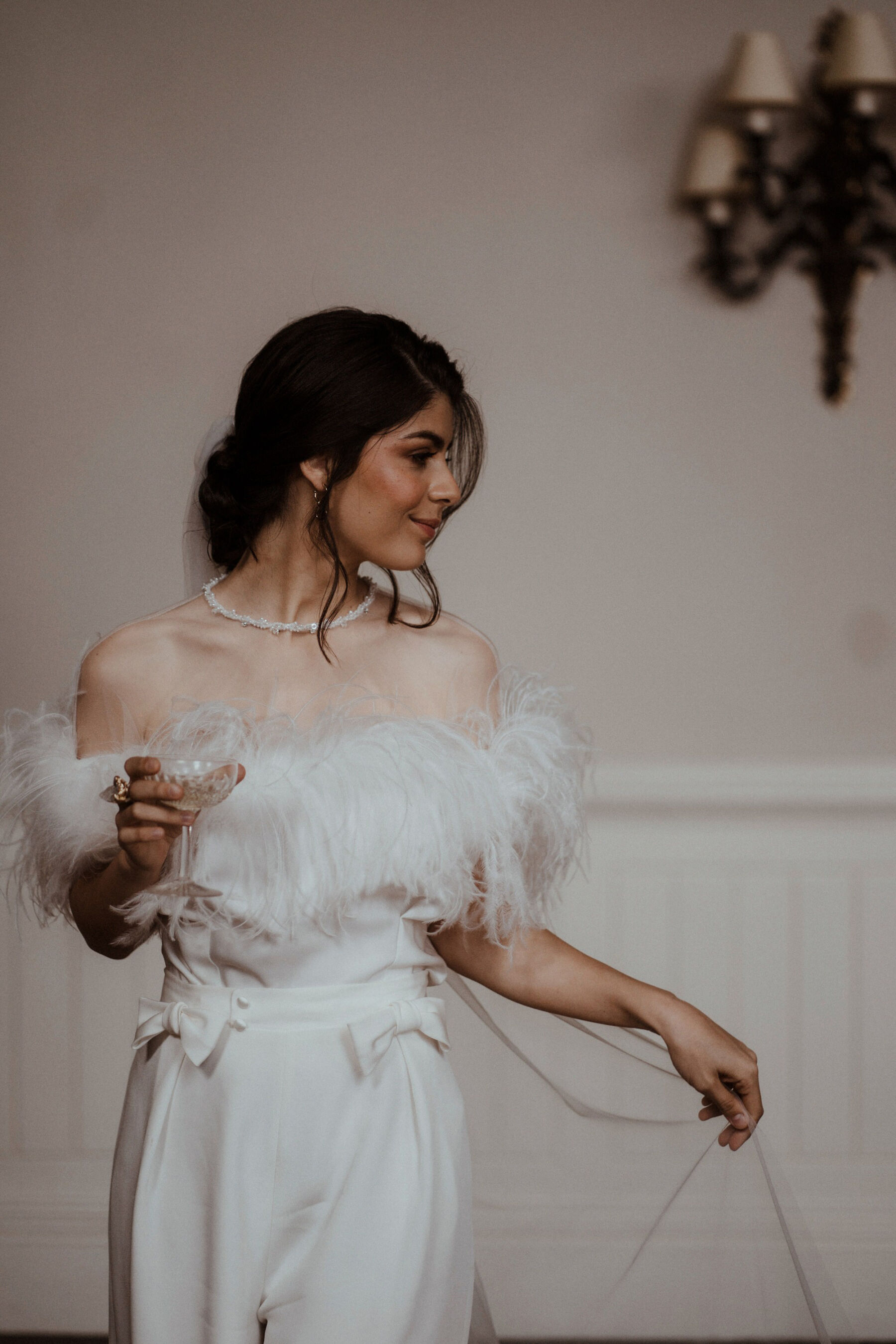 Quiet Moments of Bridal Fashion With Wilden London & Rebecca Anne Designs 14 Bride wearing ostrich feather top and silk trousers by Wilden London, Embroidered wedding veil by Rebecca Anne Designs.
