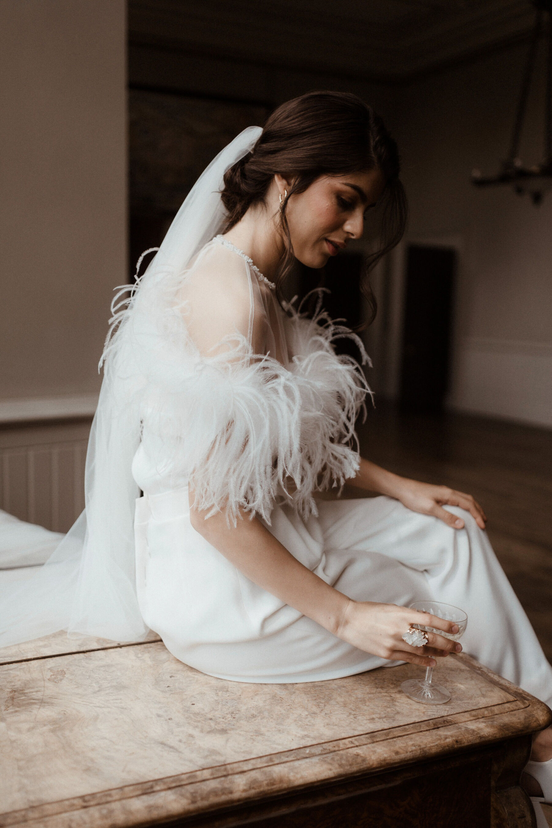 Bride wearing ostrich feather top by Wilden London.