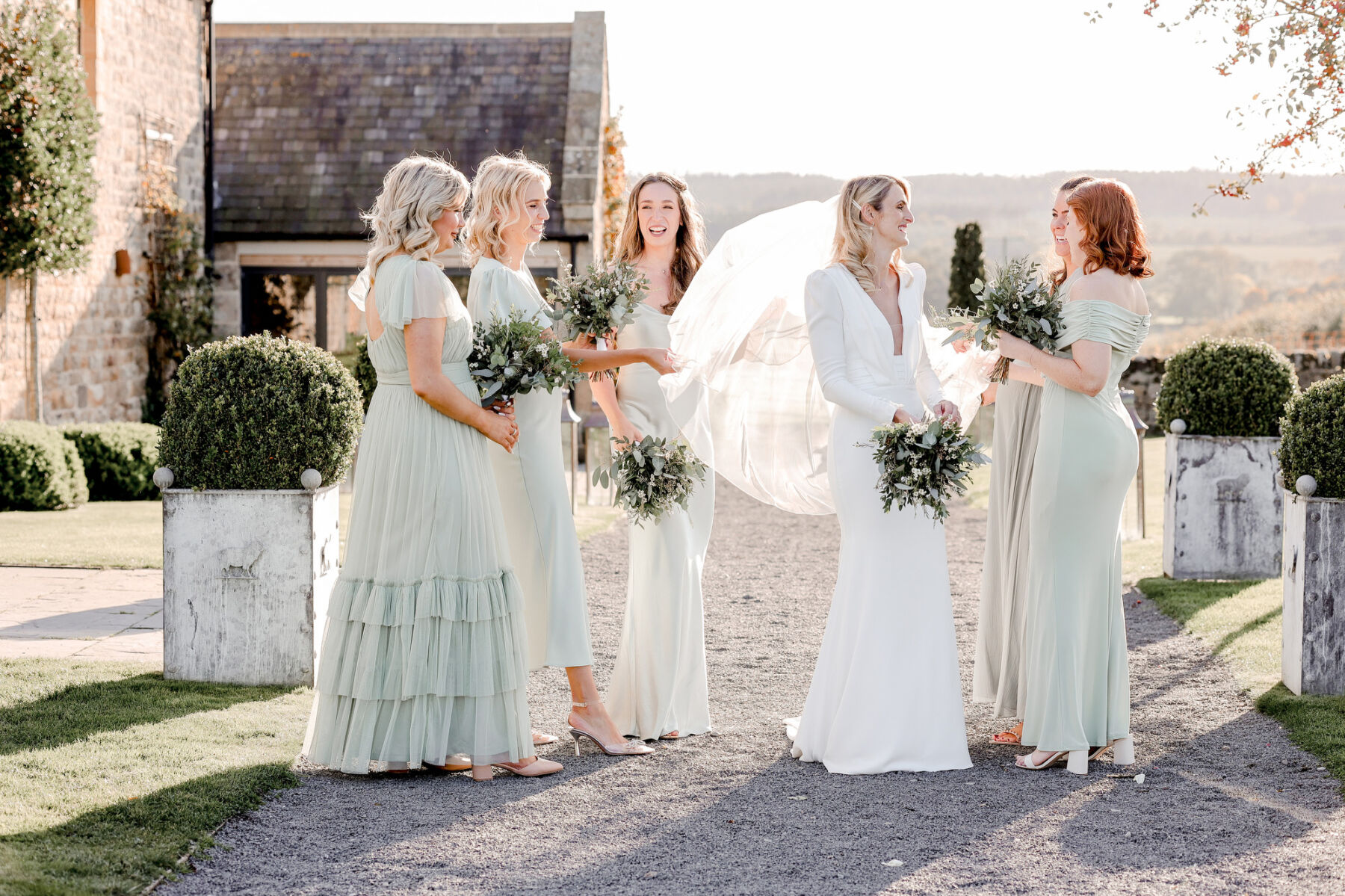 Bridesmaids in pale green dresses