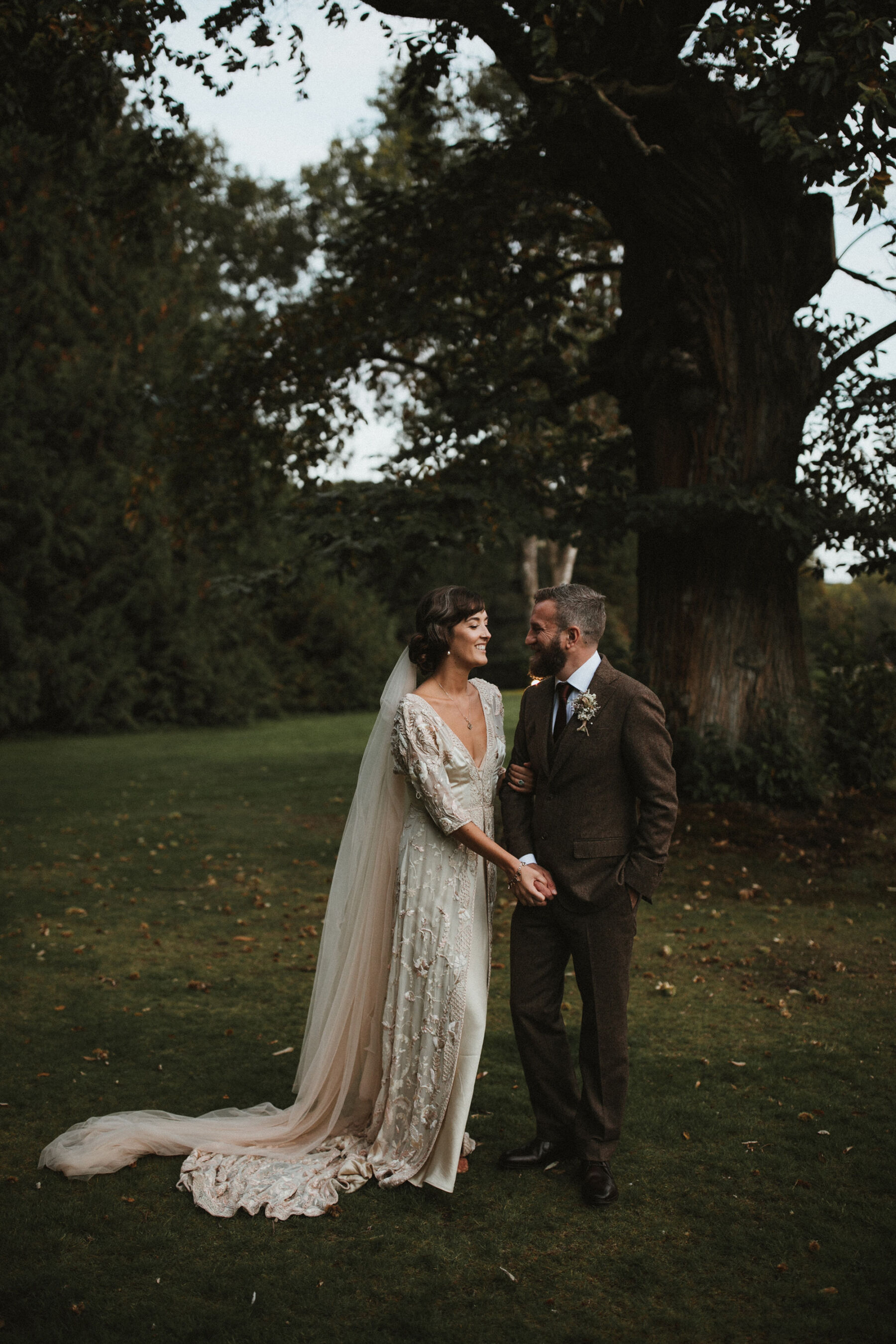 Bride in a vintage wedding dress from Jane Bourvis and 1920s inspired waves in her hair.