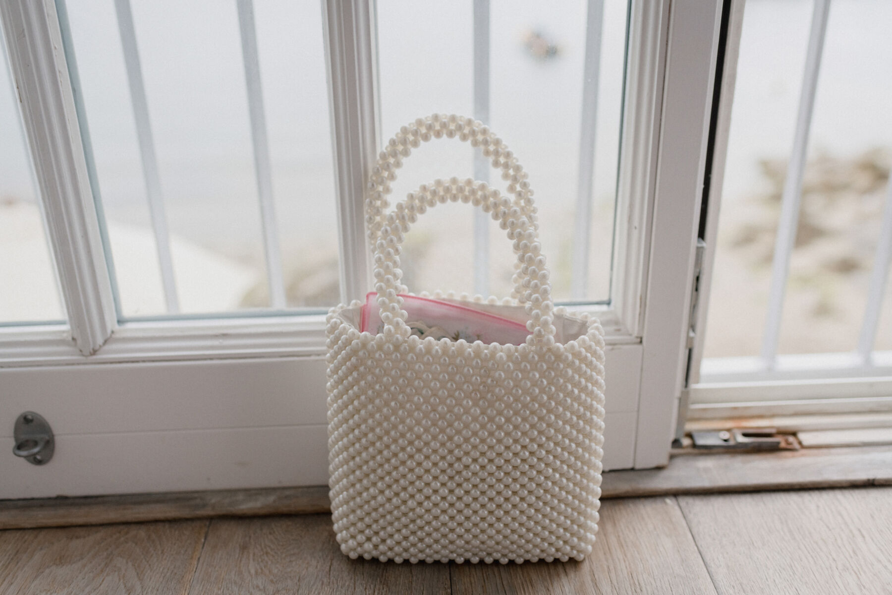 A Laidback Wedding in Cornwall With Dried Flower Bouquets 12 Shrimps pearl handbag.