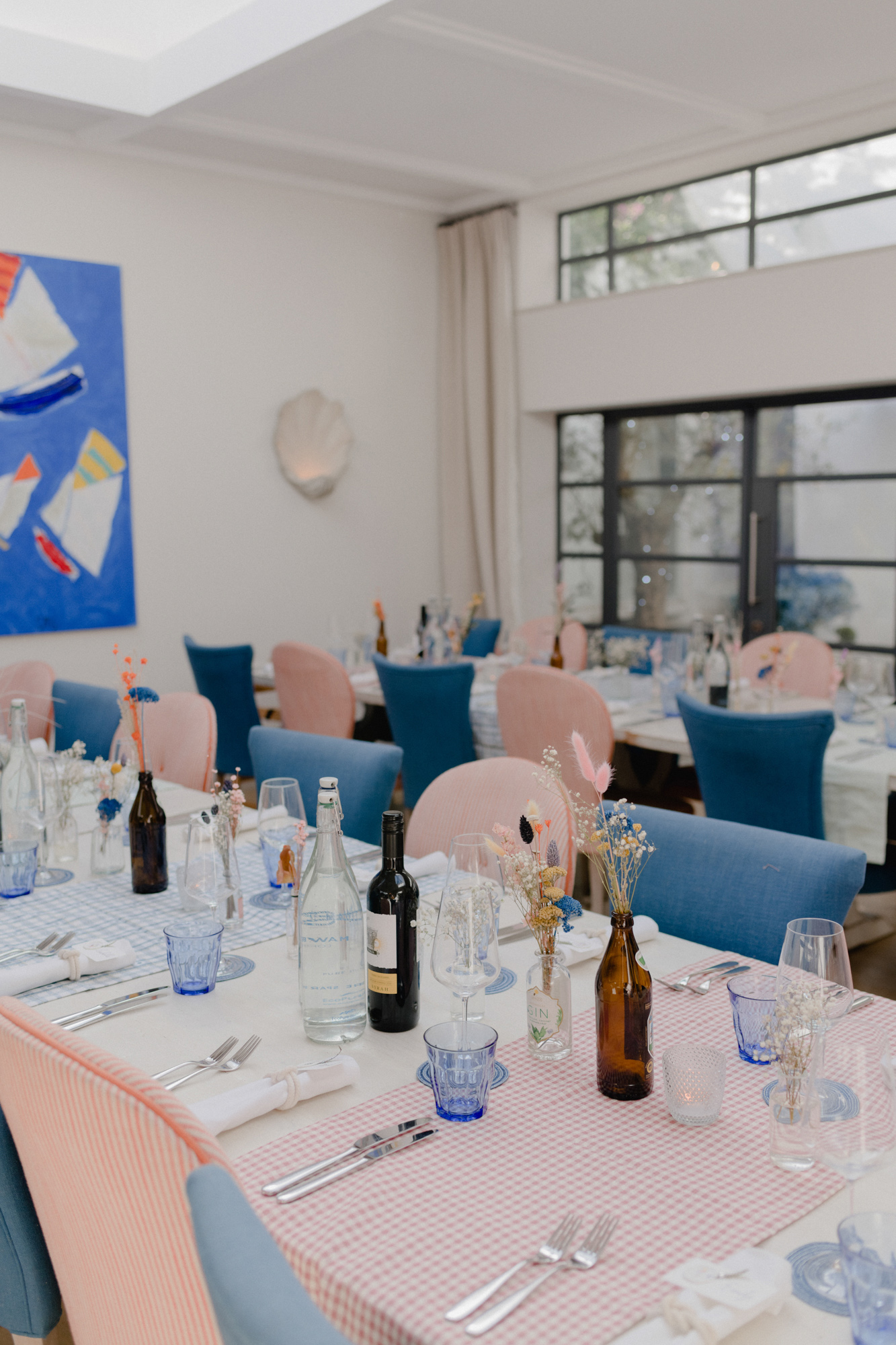 Pastel pink colour chairs at a wedding reception