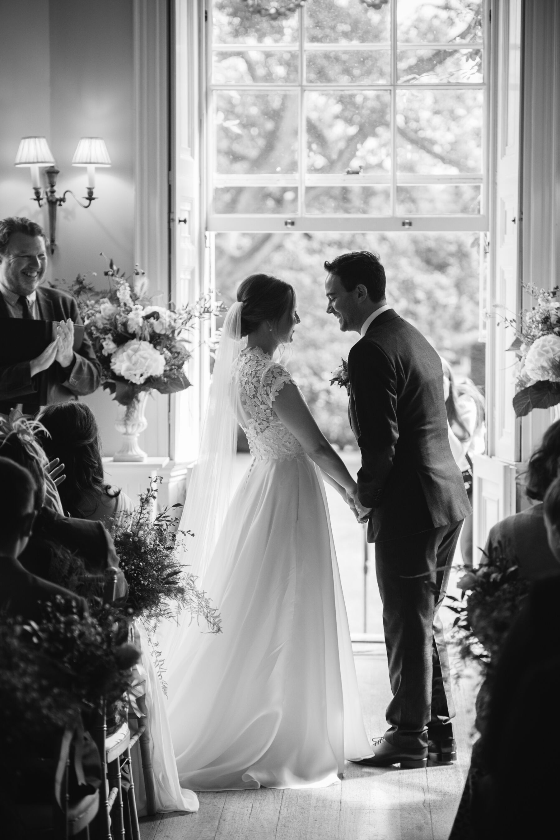 Black and white photograph of bride and groom in the Fig House at Middleton Lodge.