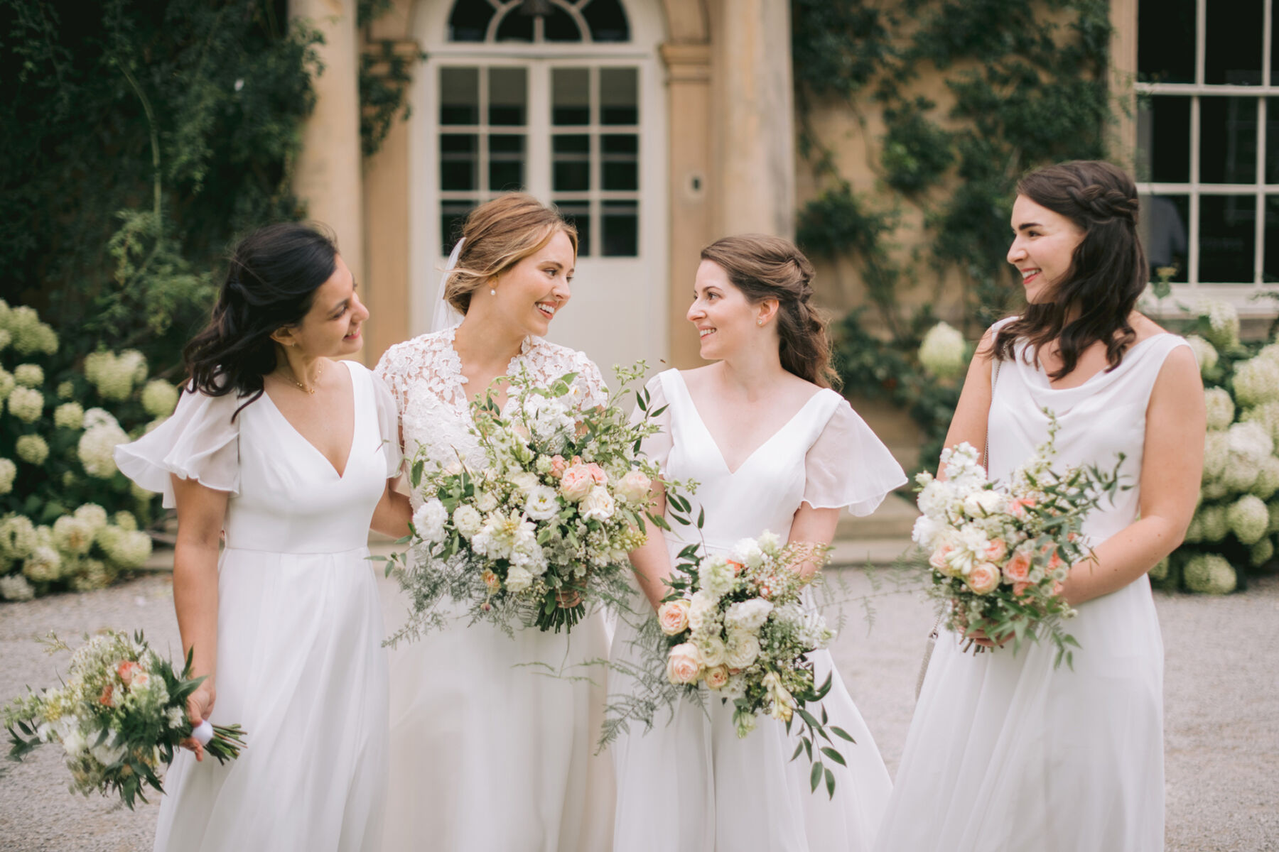 Bride in Caroline Castigliano. Bridesmaids in white. Middleton Lodge wedding.