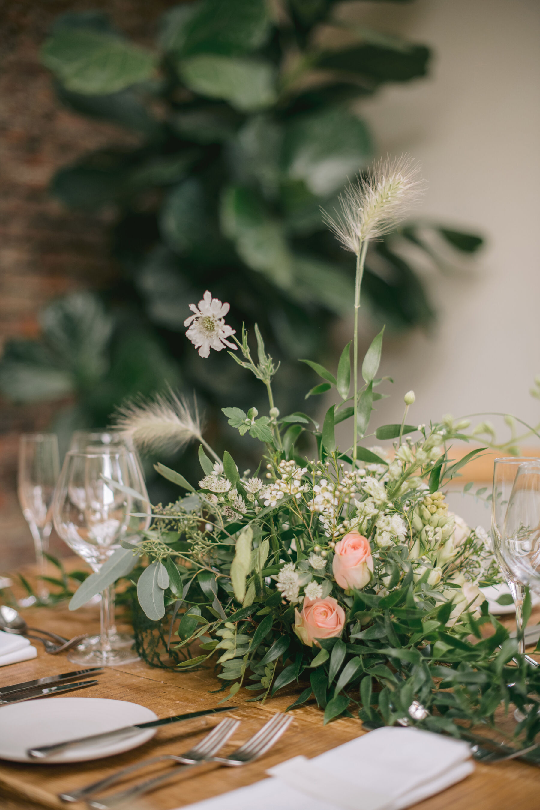 Beautiful seasonal summer wedding table flowers at Middleton Lodge.