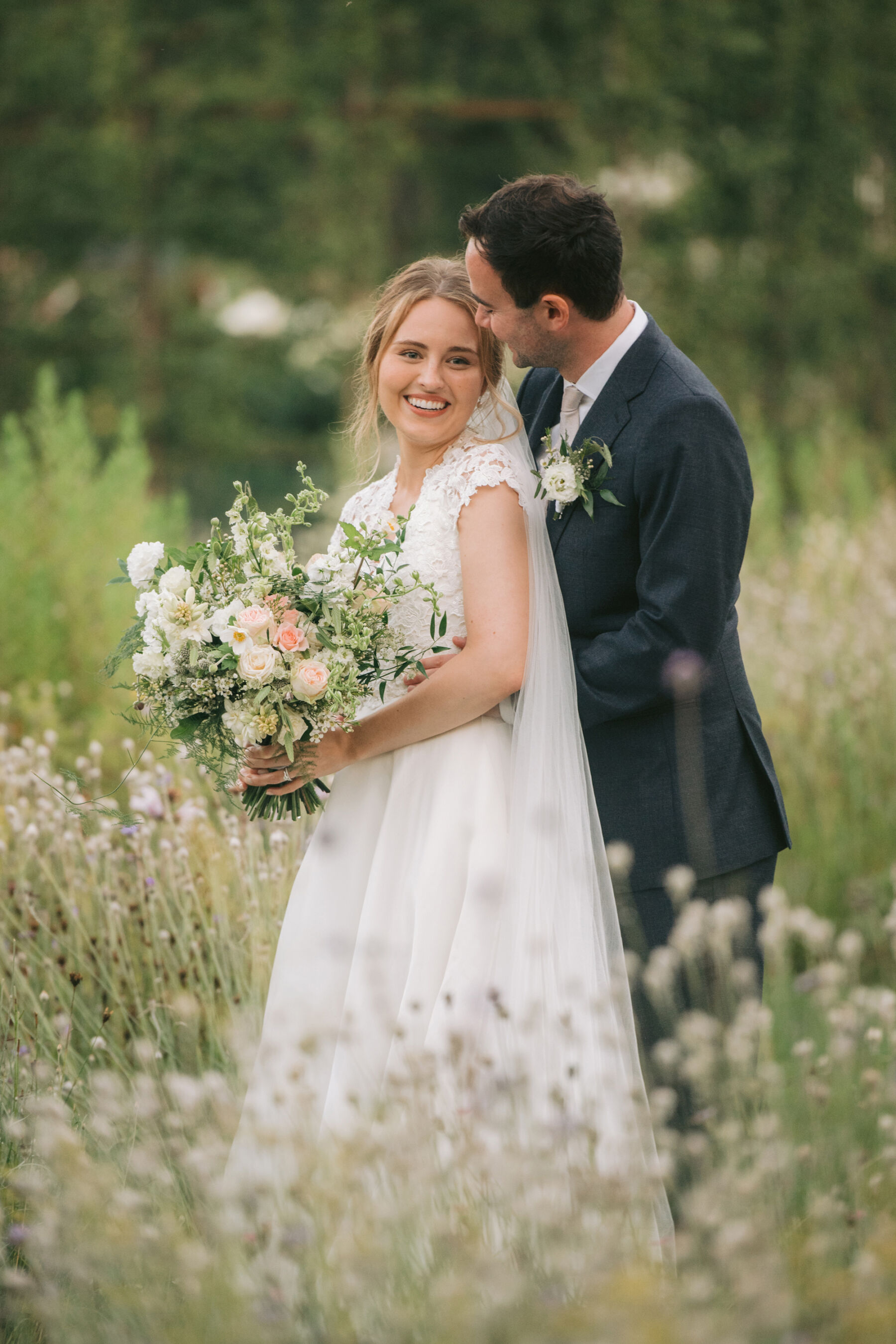 Caroline Castigliano dress, summer wedding bouquet. Middleton Lodge wedding.