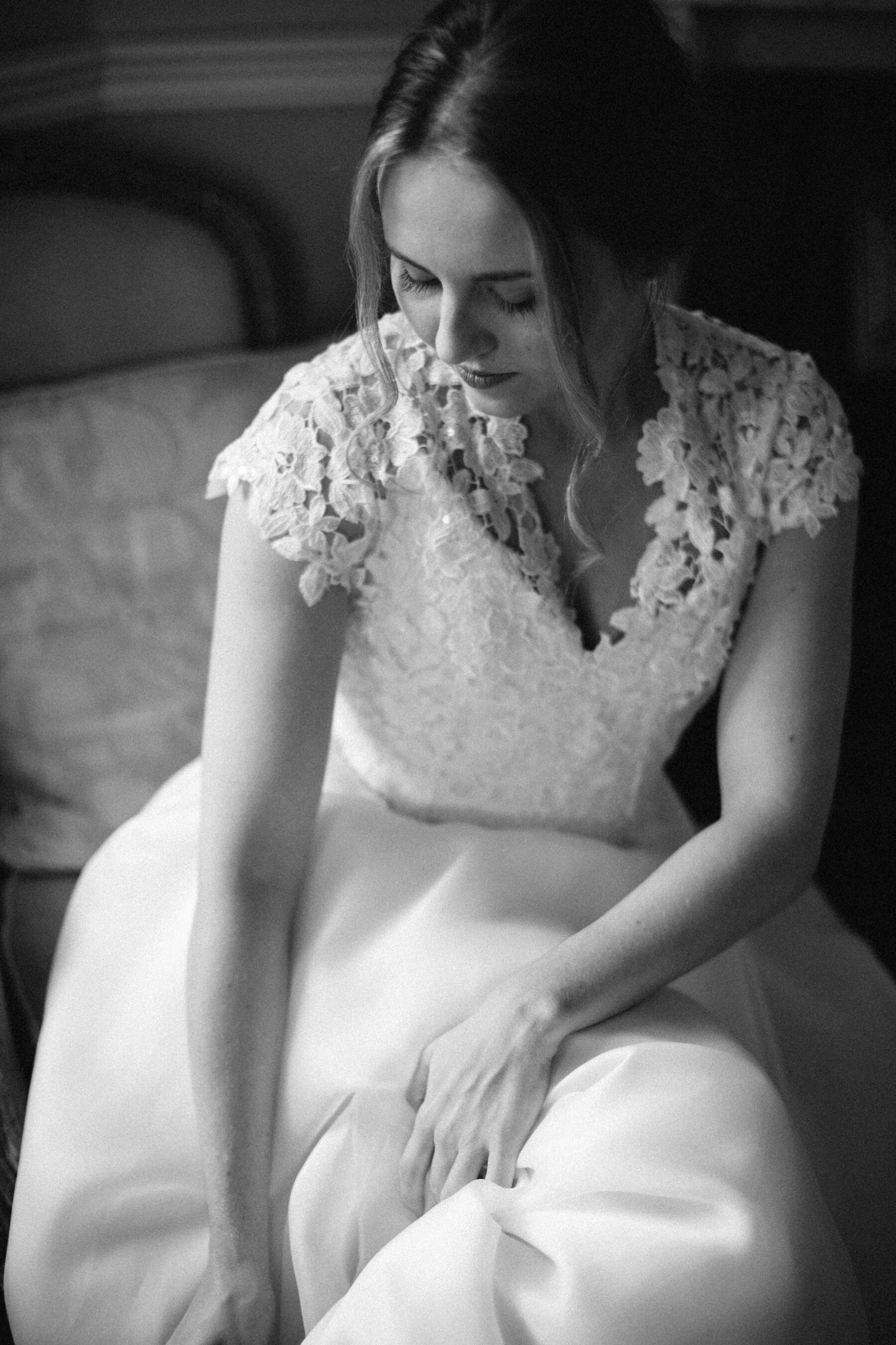 Bride putting on her wedding shoes.