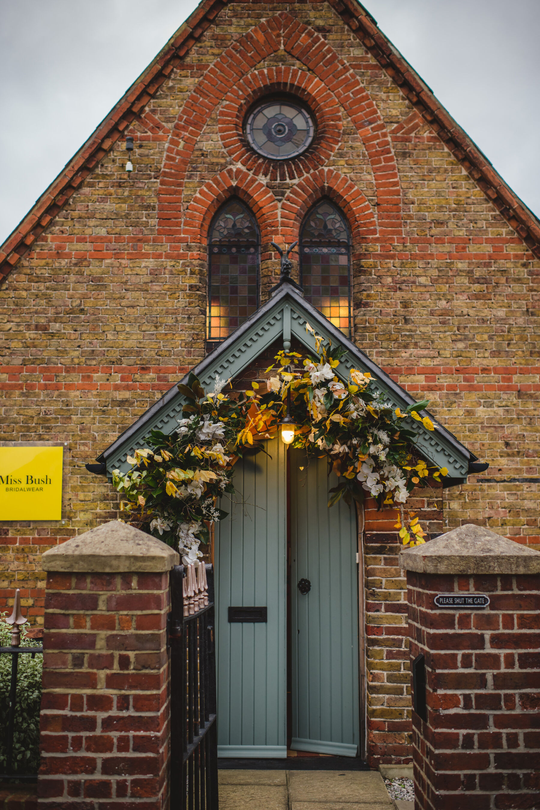 Miss Bush bridal boutique inside a converted chapel, with flowers decorating the entrance.