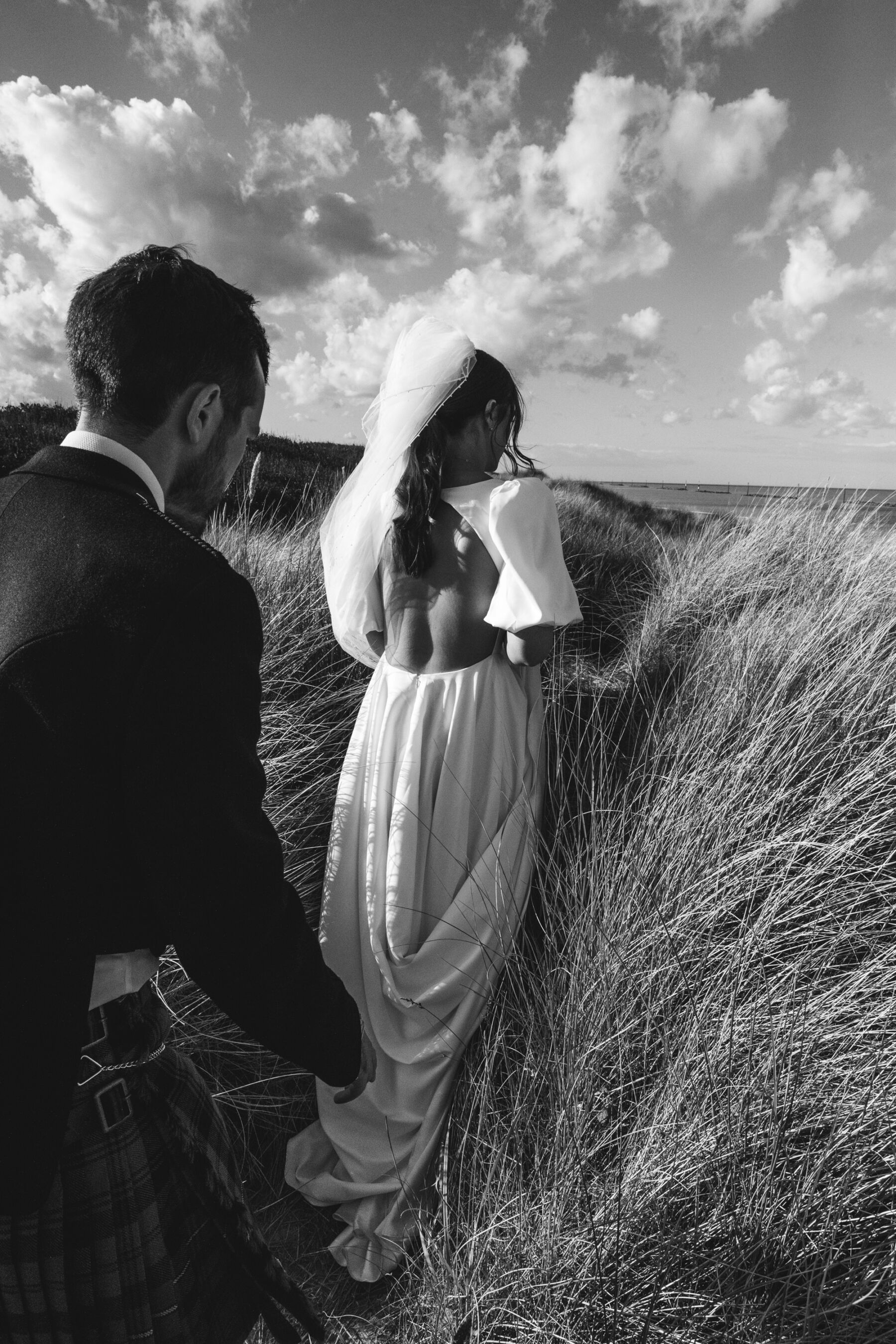 Bride with backless & For Love wedding dress