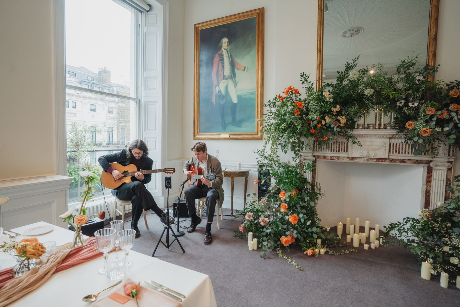 Live acoustic duo playing in a light and airy room at 41 Portland Place, London.