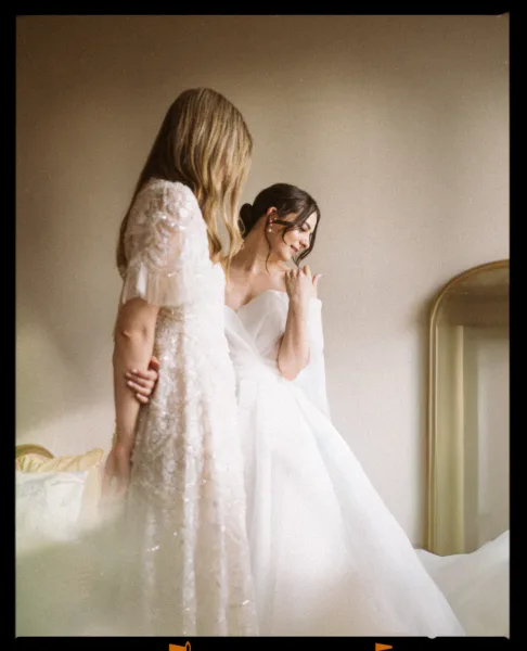 bride looking at her dress at Euridge manor in wiltshire