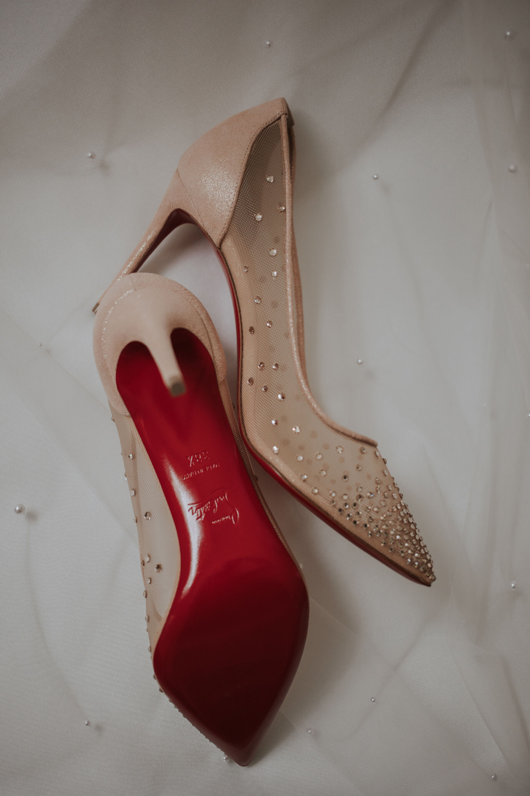 Red sole Louboutin weddin gshoes.
