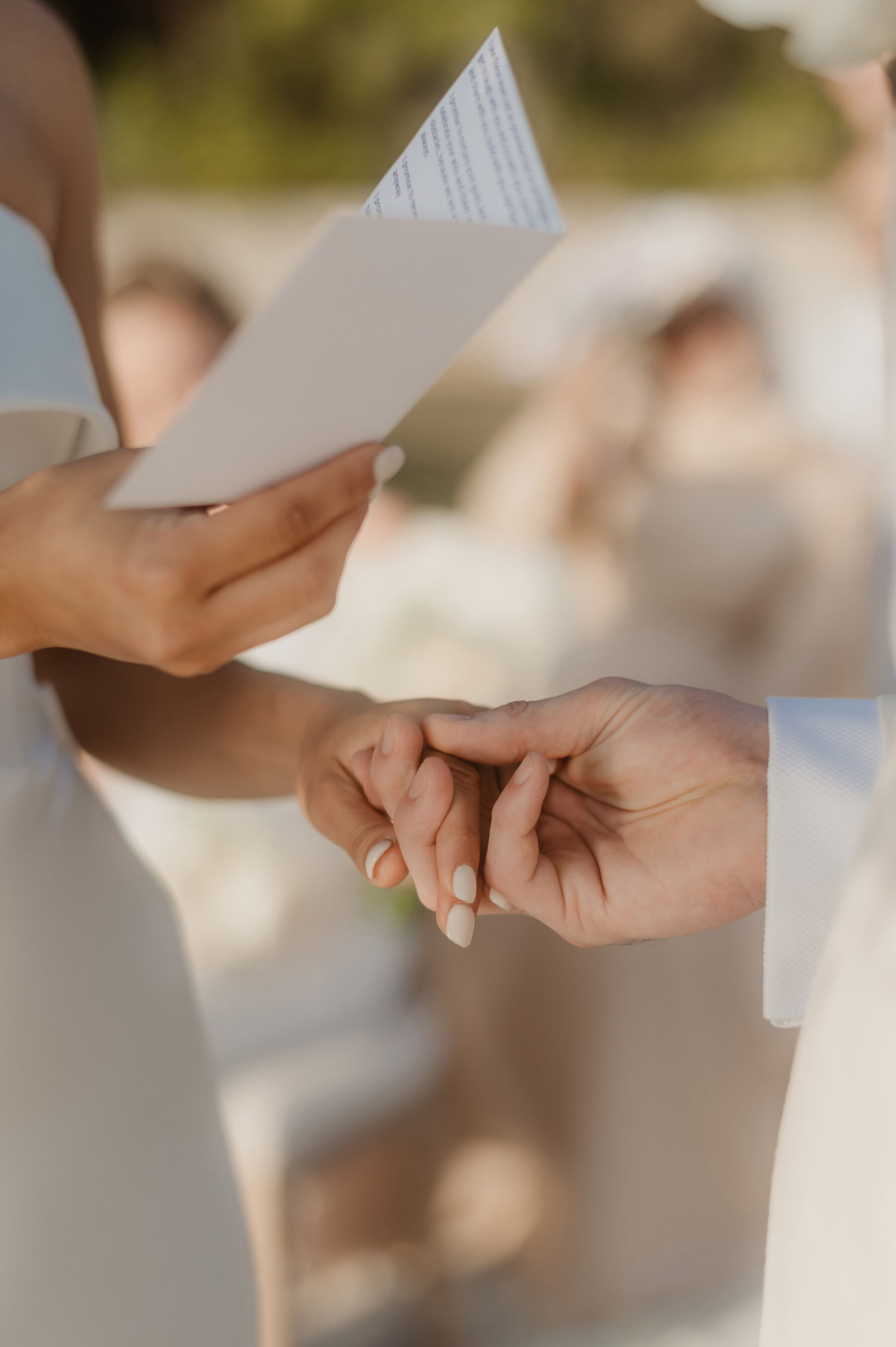 Sarah in Eva Lendel for her Classy & Contemporary Wedding in Croatia 29 Bride with white nail polish reading her vows