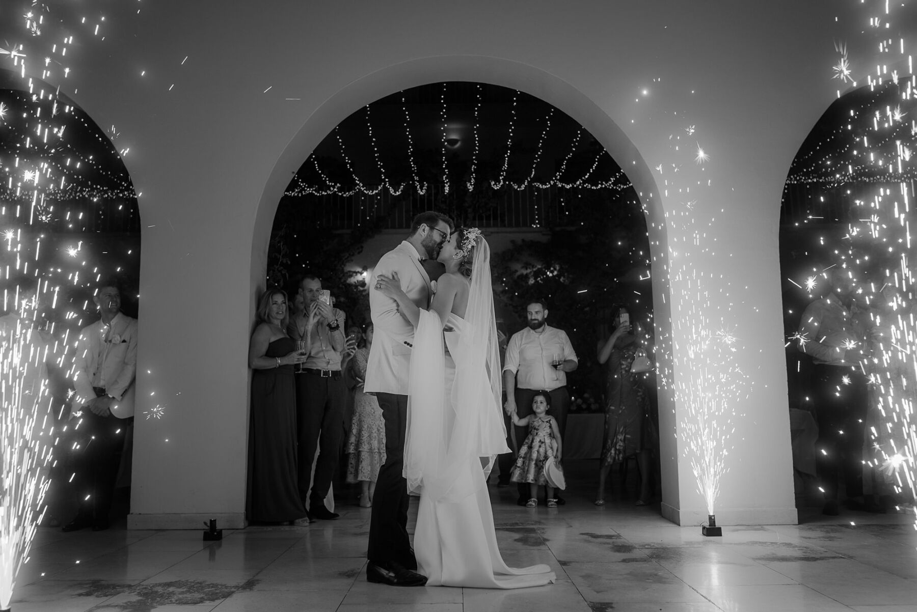 Bride and groom first dance with sparklers.