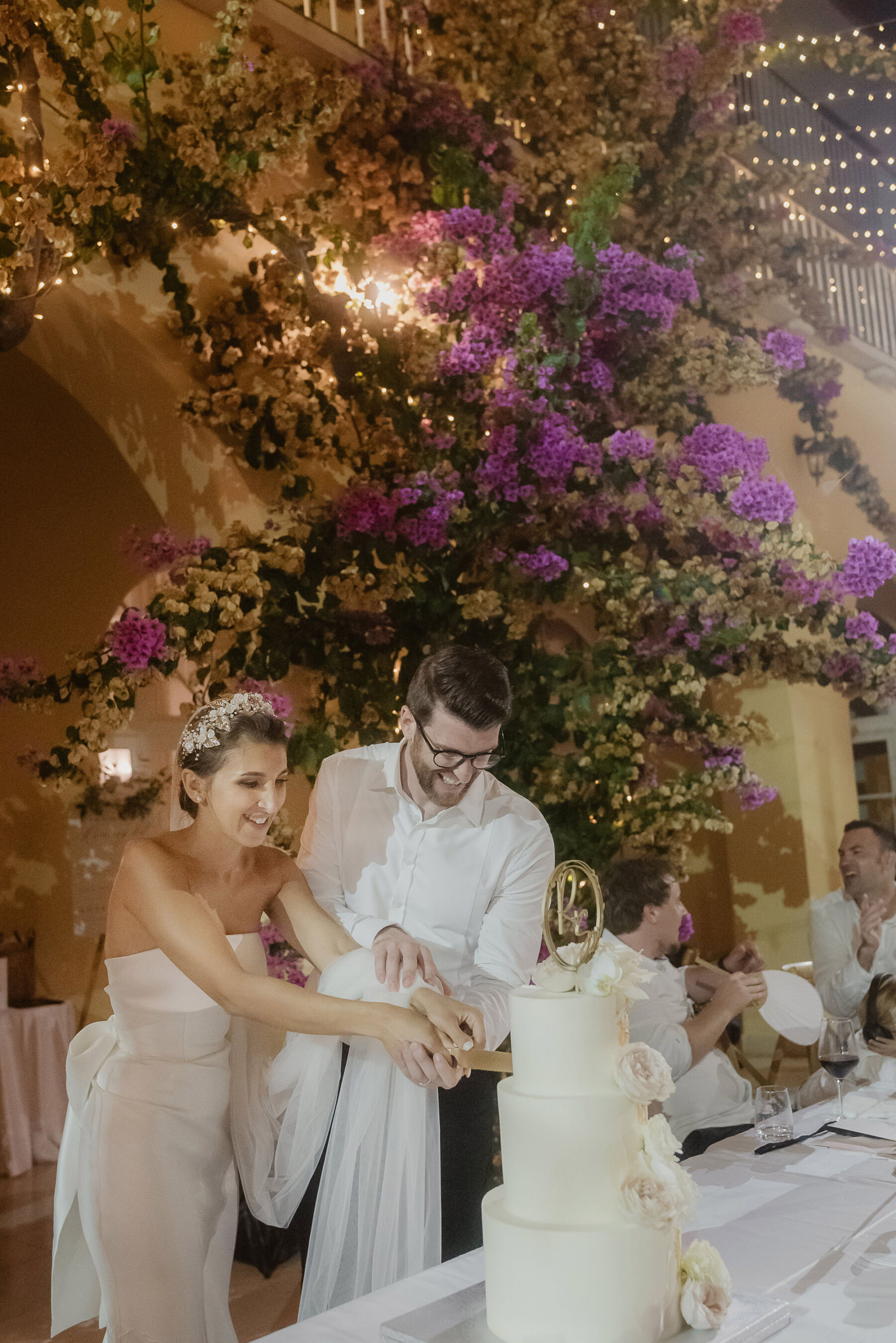 Bride and groom cutting the cake at their wedding ceremony in Croatia. Villa Dalmatia in Split, Croatia