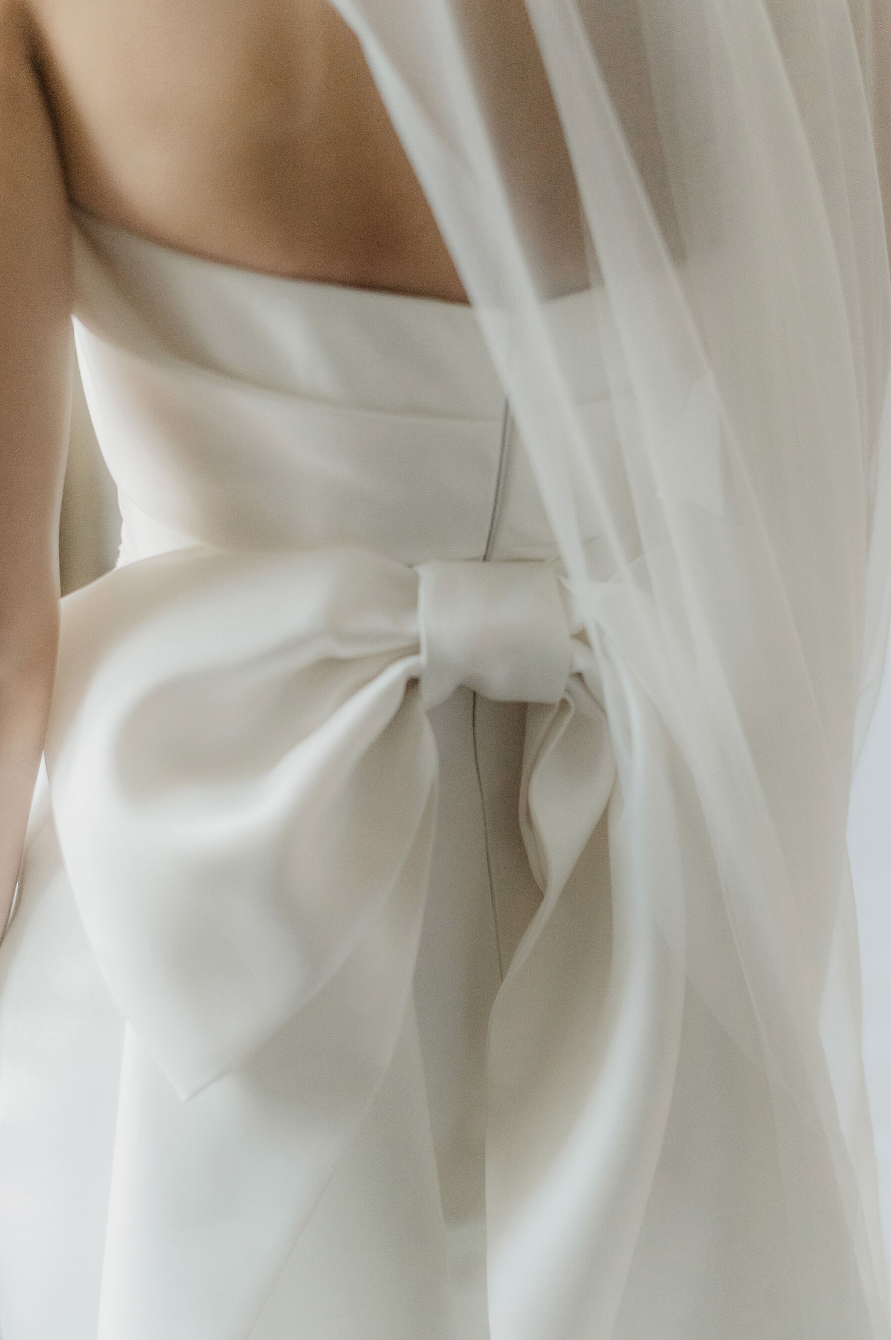 Eva Lendel wedding dress with big bow at the back.
