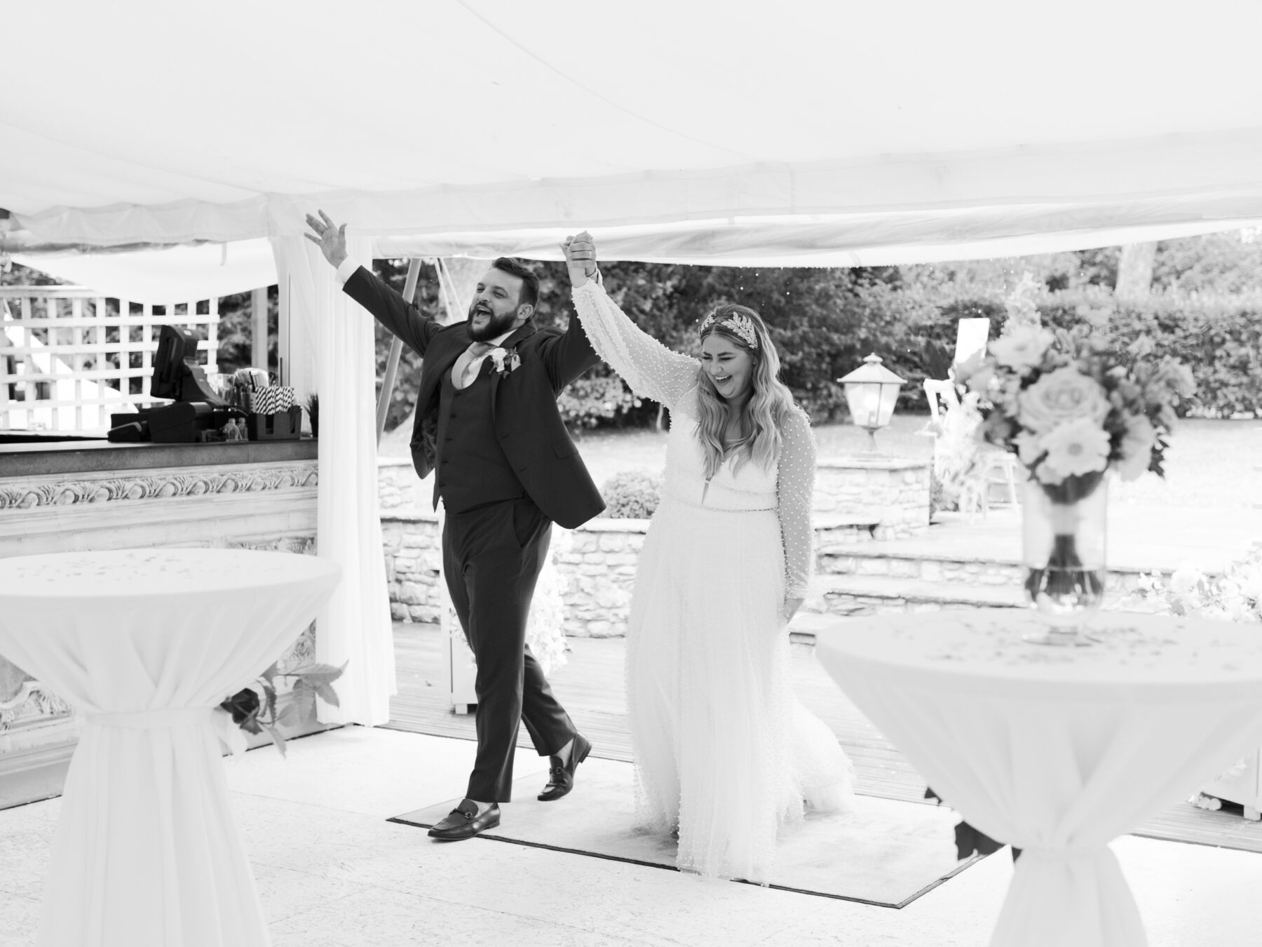 A Bridal Gown Covered in Pearls for a Nature Inspired & Whimsical Wedding at Gileston Manor in Wales 46 Bride and groom entering their wedding marquee to a round of applause