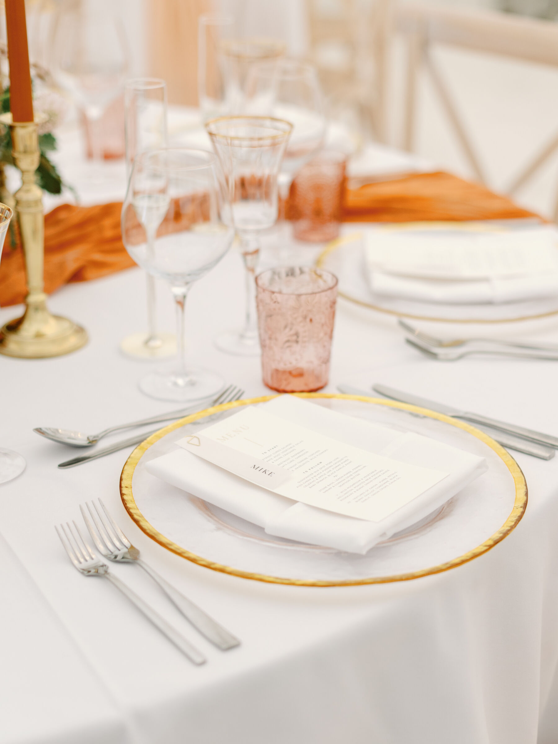 A Bridal Gown Covered in Pearls for a Nature Inspired Wedding at Gileston Manor in Wales 41 Gold rimmed charger plate at a wedding receptiion.