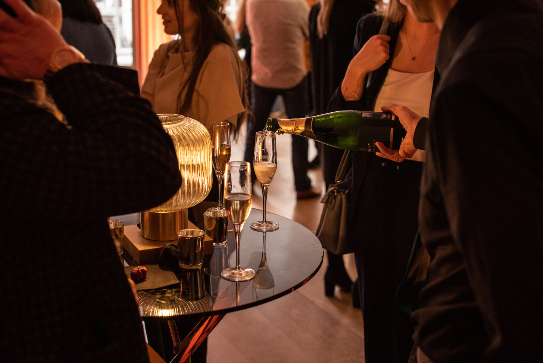 Pouring champagne at RSA House, sustainable London wedding venue