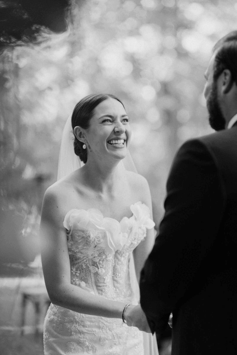 Katie in Sally Bean Couture for her American Wedding Inspired by the Whimsical English Countryside 24 Animated gif of bride and groom as they stare into each other's eyes during the wedding ceremony.