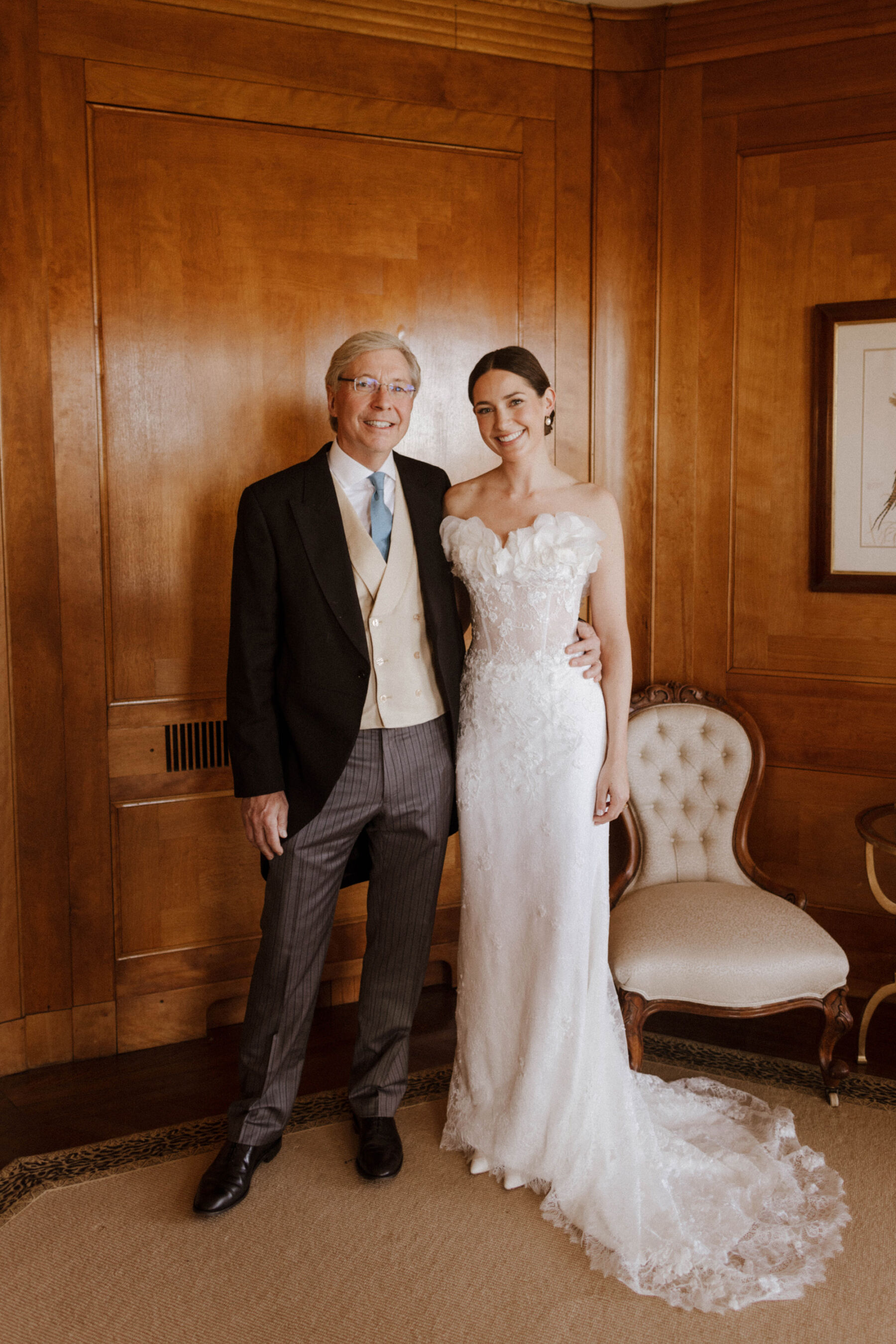 Katie in Sally Bean Couture for her American Wedding Inspired by the Whimsical English Countryside 12 Father of the bride in traditional morning suit standing with his daughter who wears a Sally Bean Couture wedding dress.