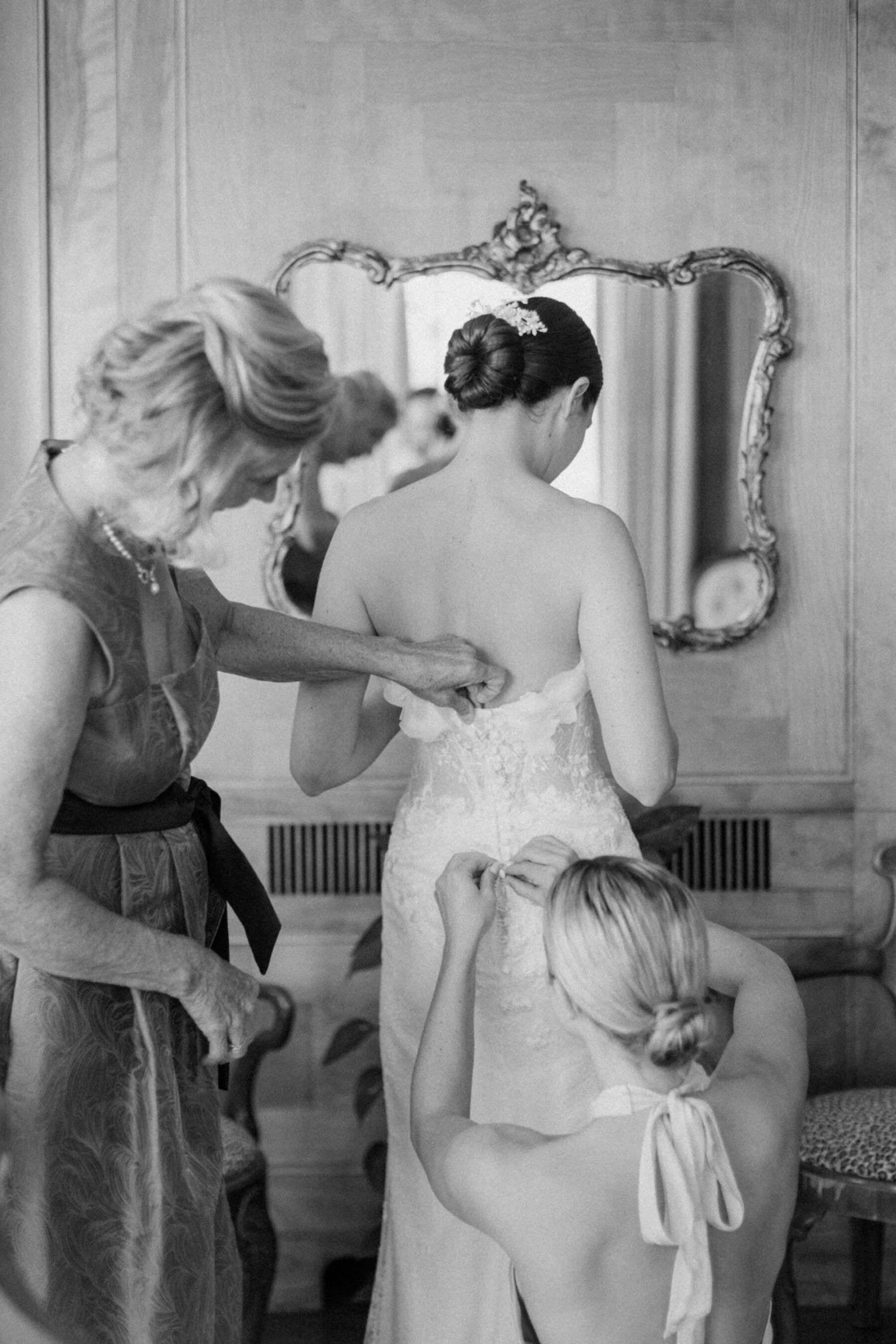 Bride getting ready in her Sally Bean Couture wedding dress.