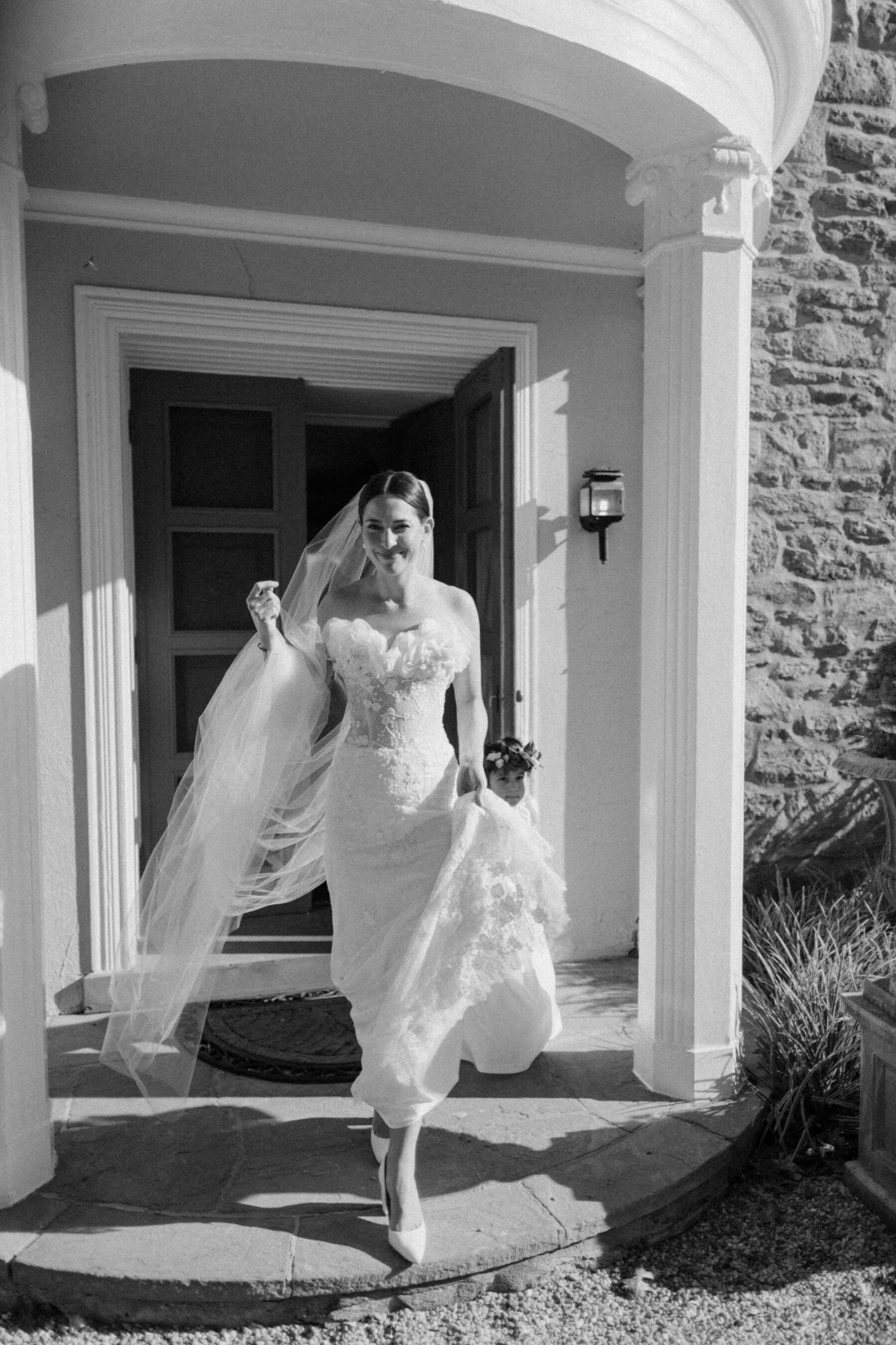 Sally Bean Couture wedding dress and simple long tulle veil. Emmy London wedding shoes.