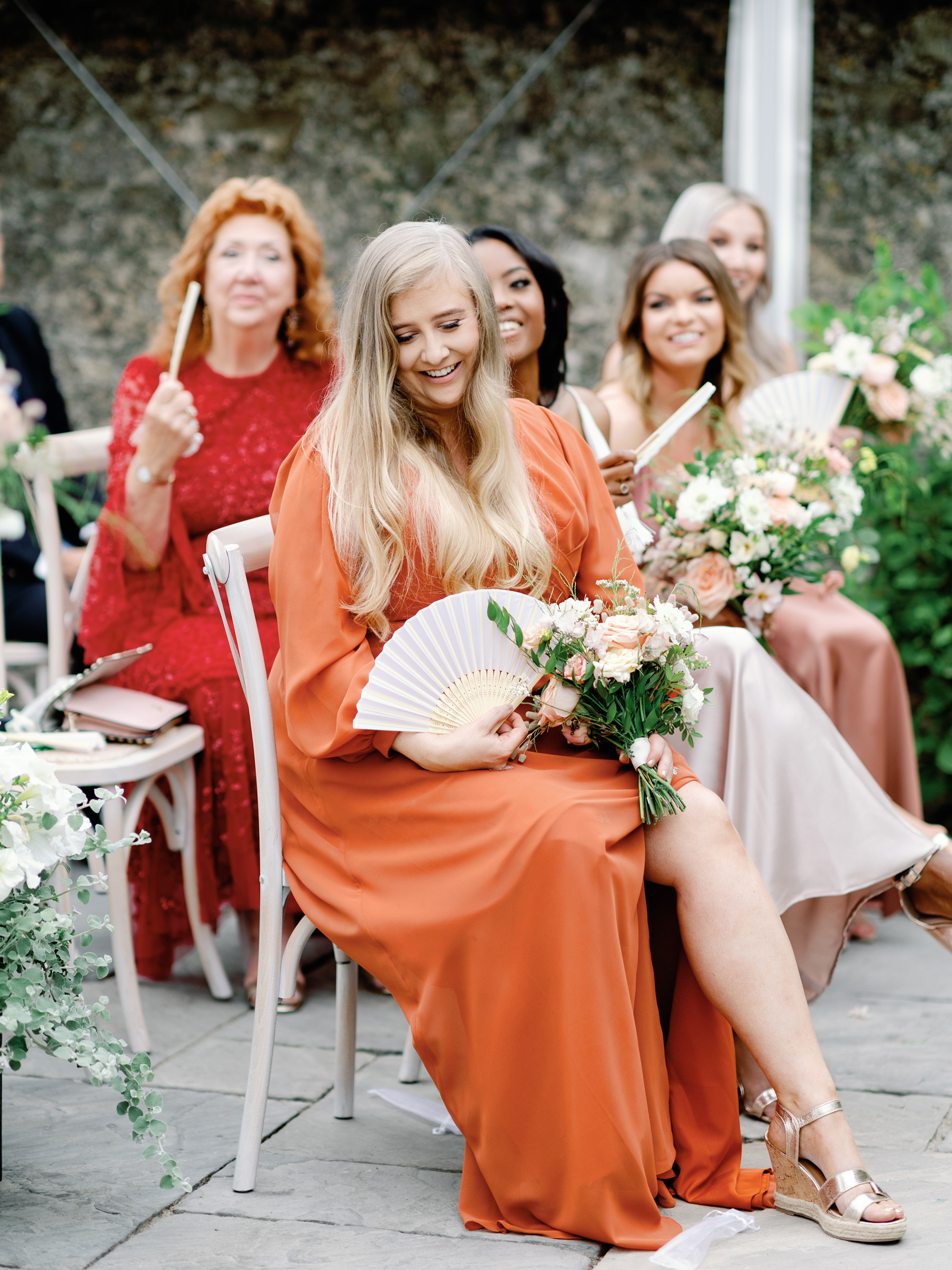 Bridesmaid in burnt orange dress by Jenny Yoo