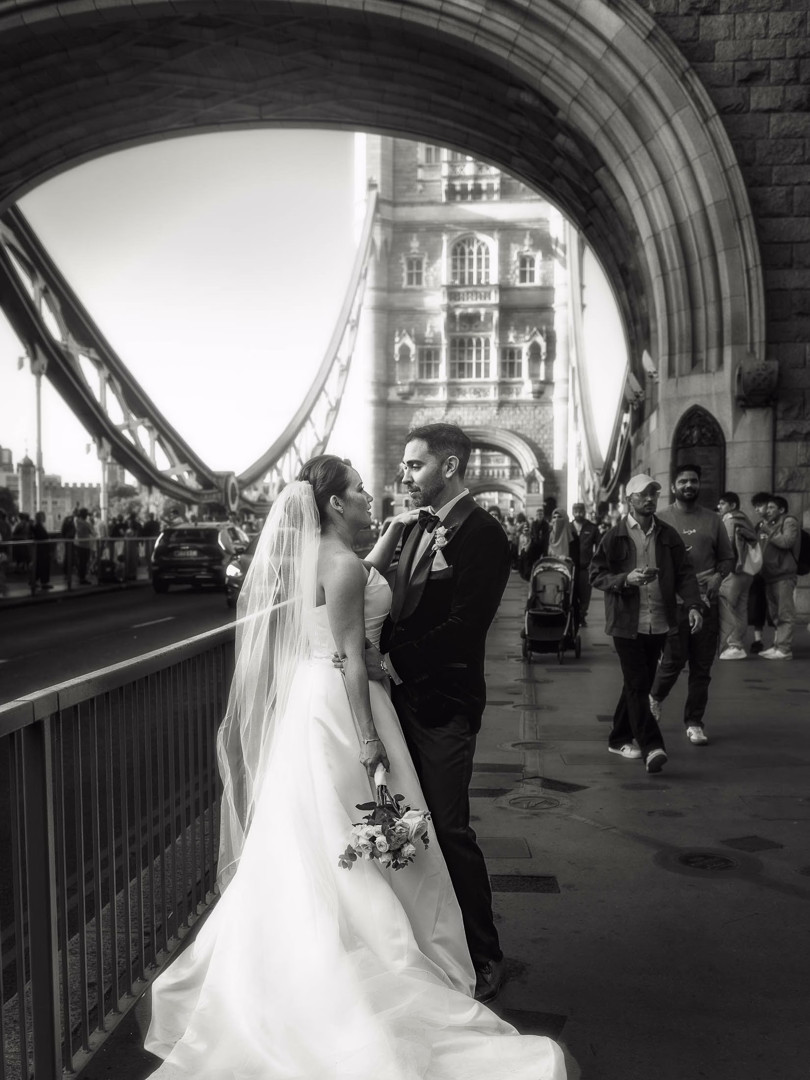bride groom pose tower bridge black tie london wedding - Marie in Danielle Frankel for Her Romantic French Wedding at Chateau Lagut, Inspired by Tolkien’s Lothlórien Luke Batchelor Productions
