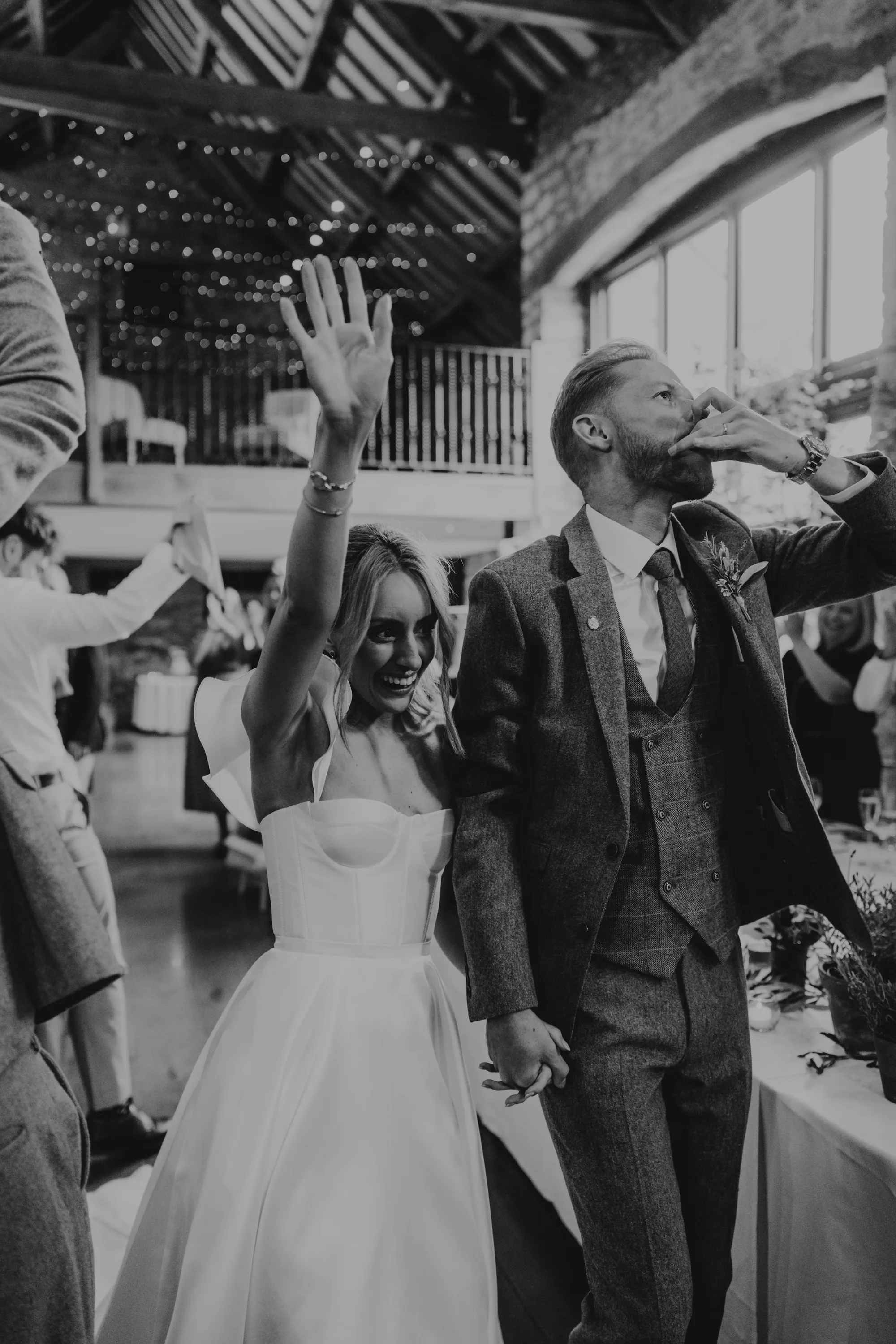 couple entering the barn at priston mill wedding venue