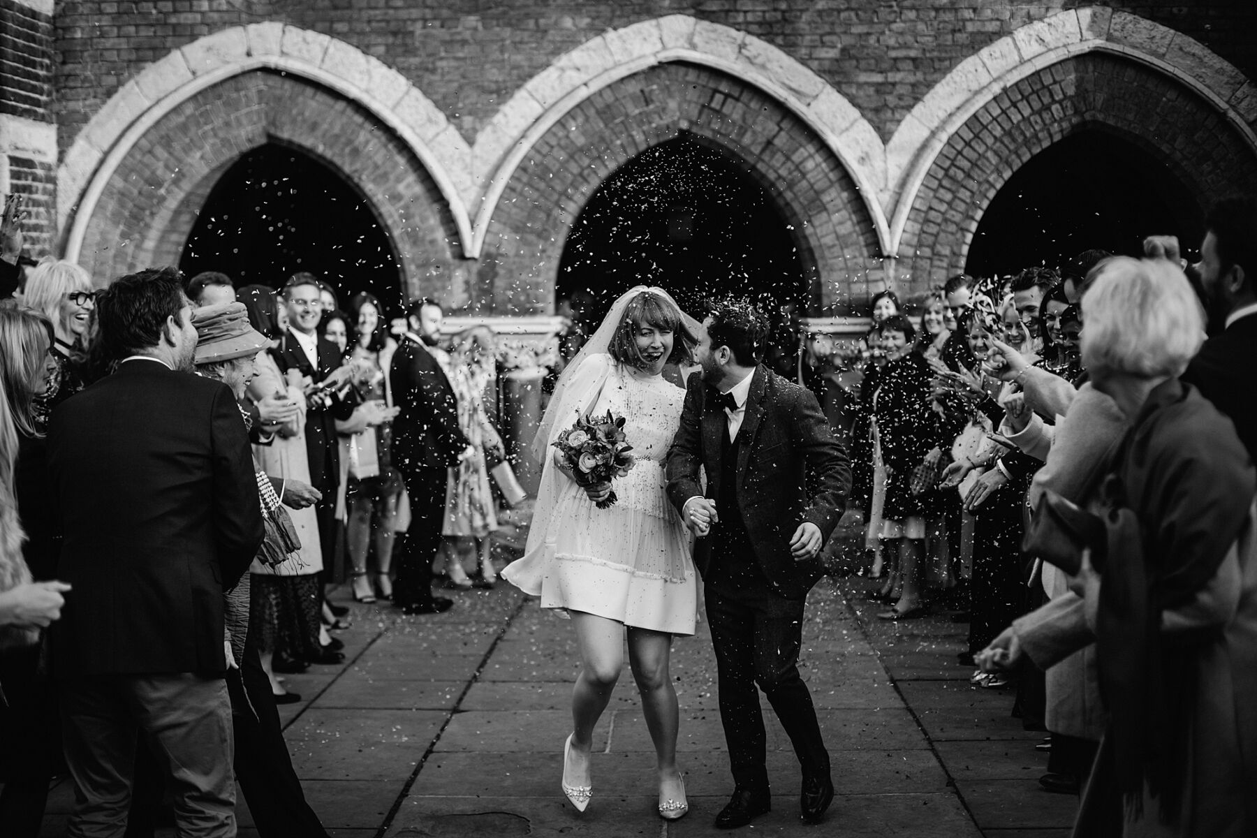 Introducing Claudia Rose Carter: Empowering Women in Business + 50% Savings on Wedding Photography 6 1960's inspired bride in a mini dress in a shower of confetti, by Claudia Rose Carter Photography.