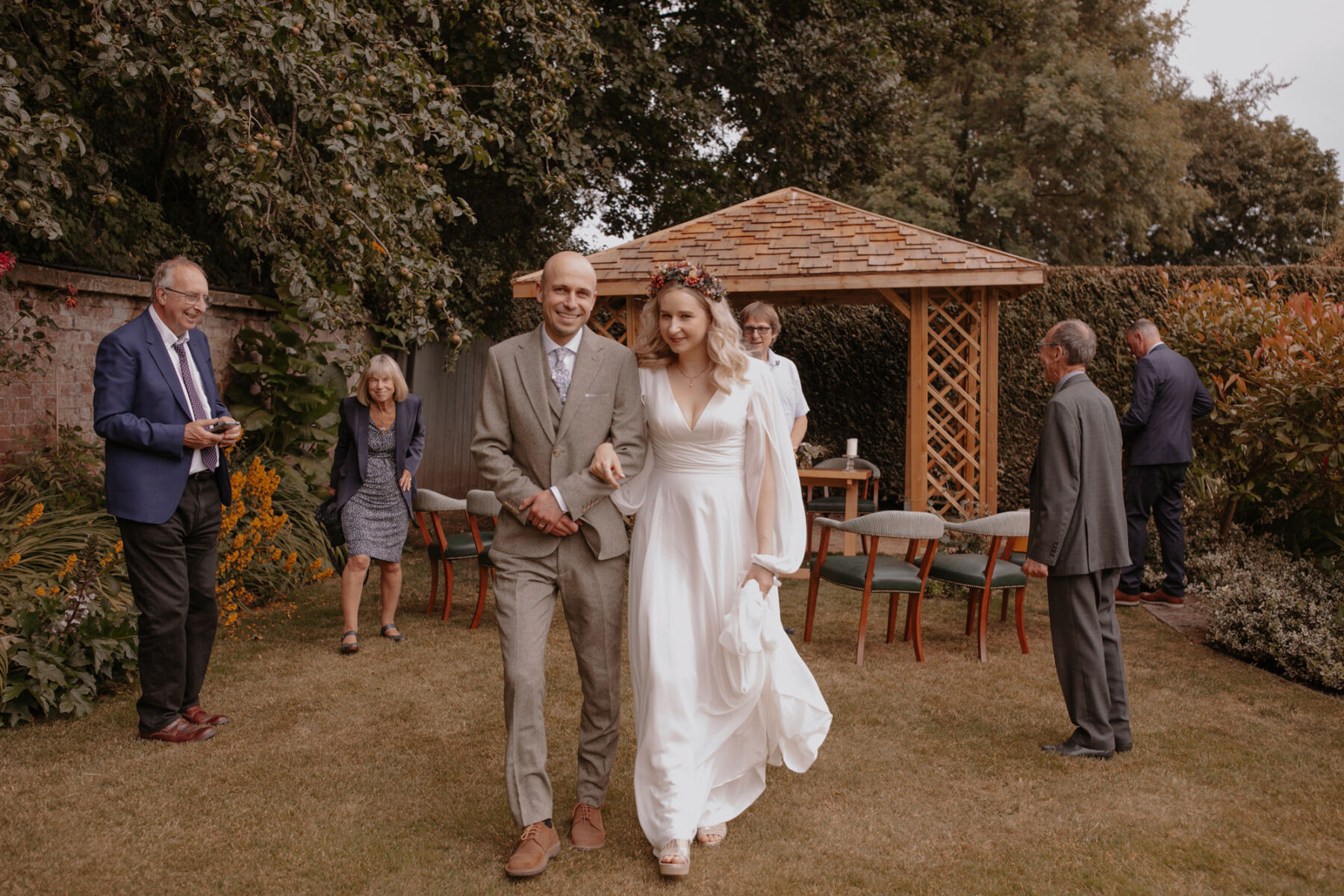 Bride in billowed sleeve wedding dress - outdoor ceremony.