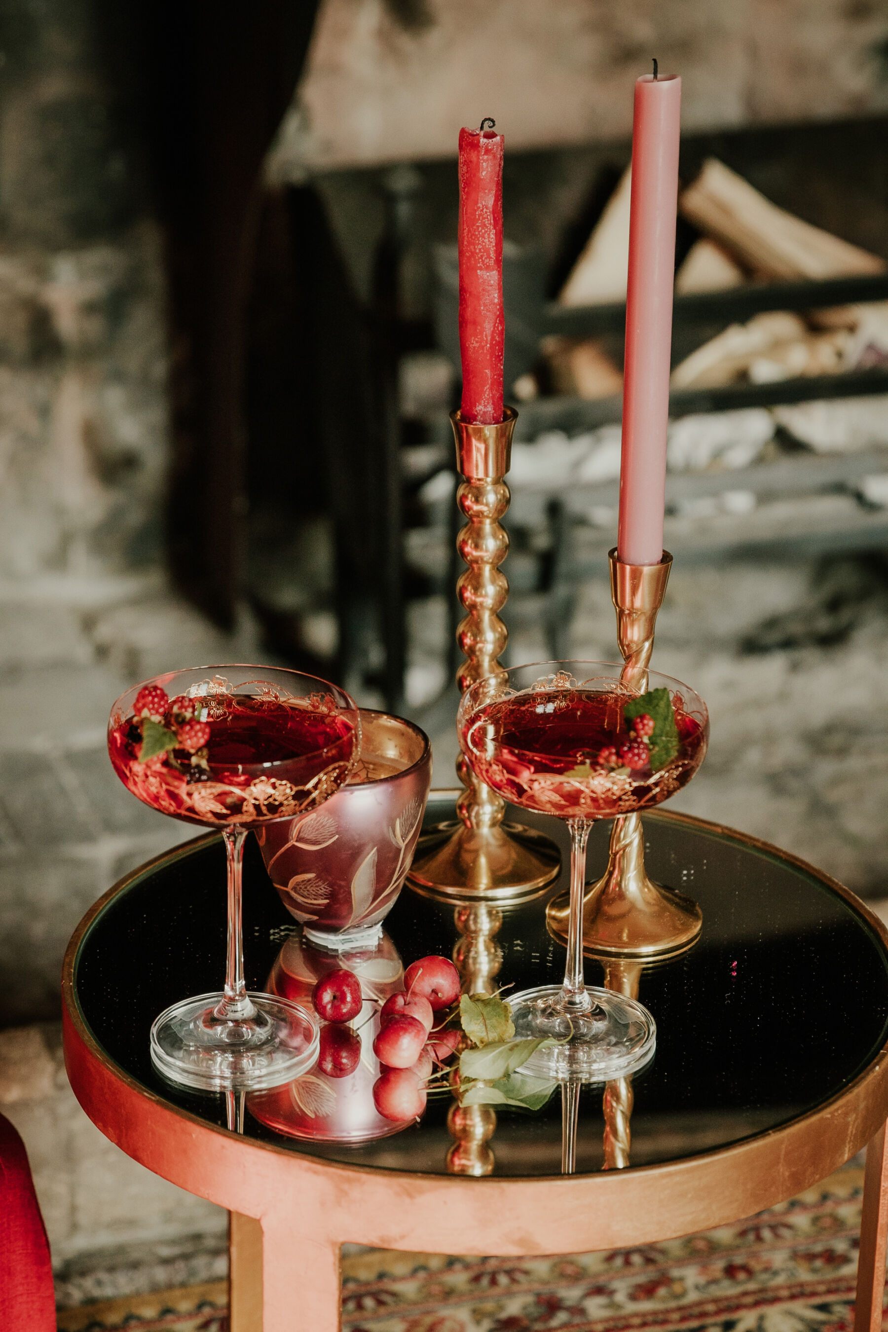 Tall stem glasses with red wedding cocktails. 