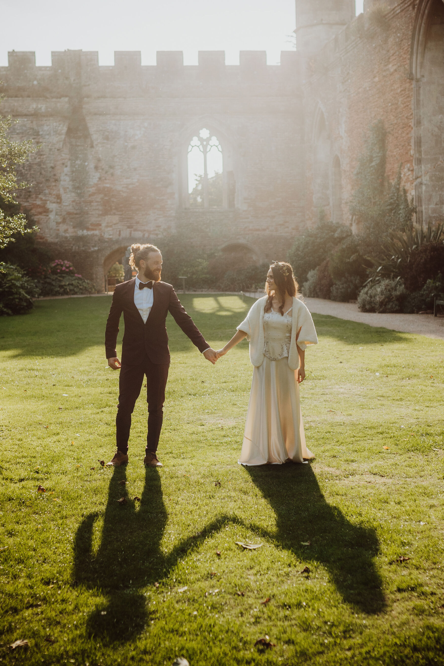 The Bishop's Palace, A Magical, Romantic and Historic Somerset Wedding Venue 4 Bride in a vintage dress with her groom in a bow tie at Bishop's Palace historic wedding venue in Wells, Somerset.