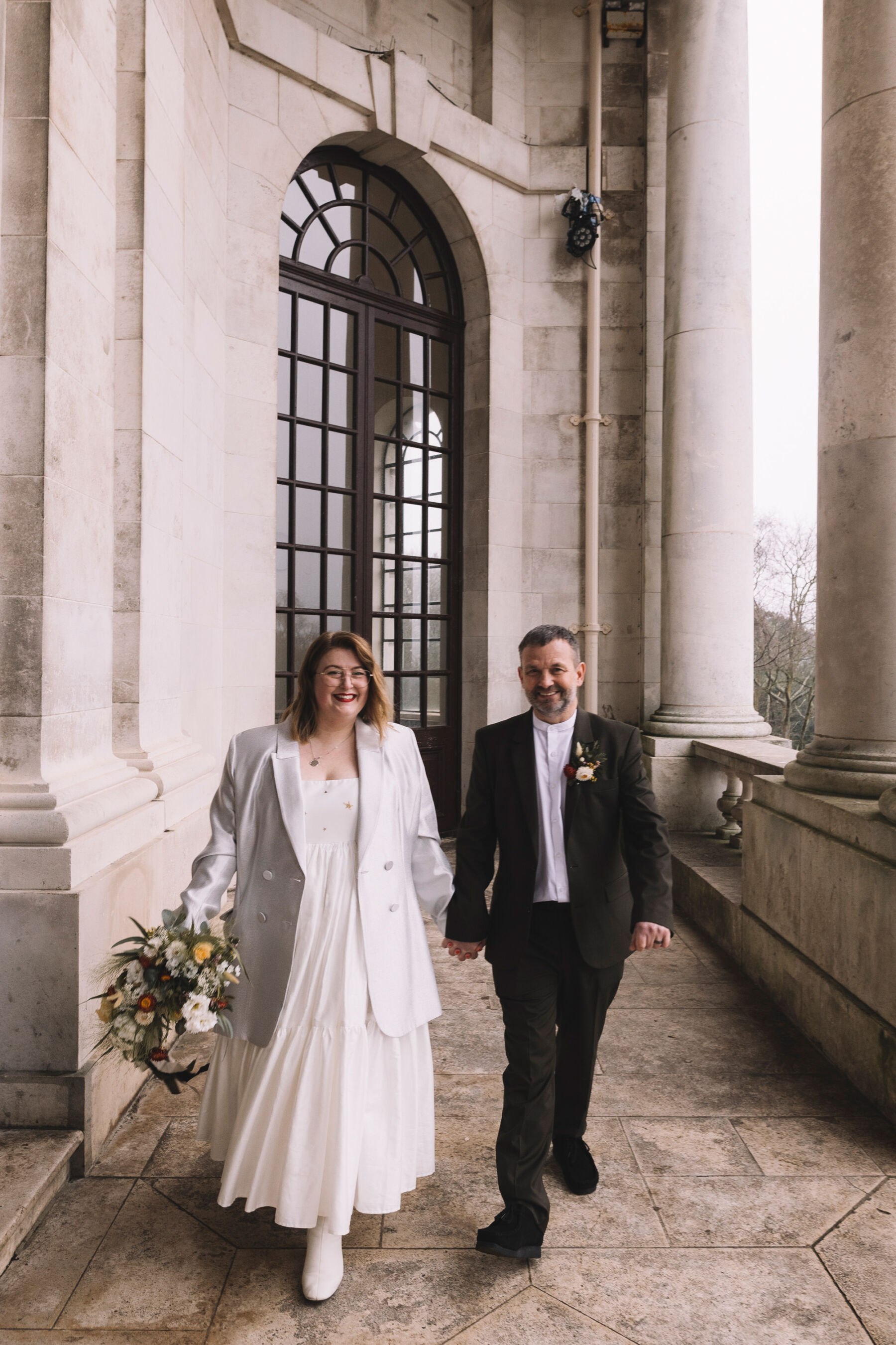 Bride in a Mary Benson wedding dress & jacket