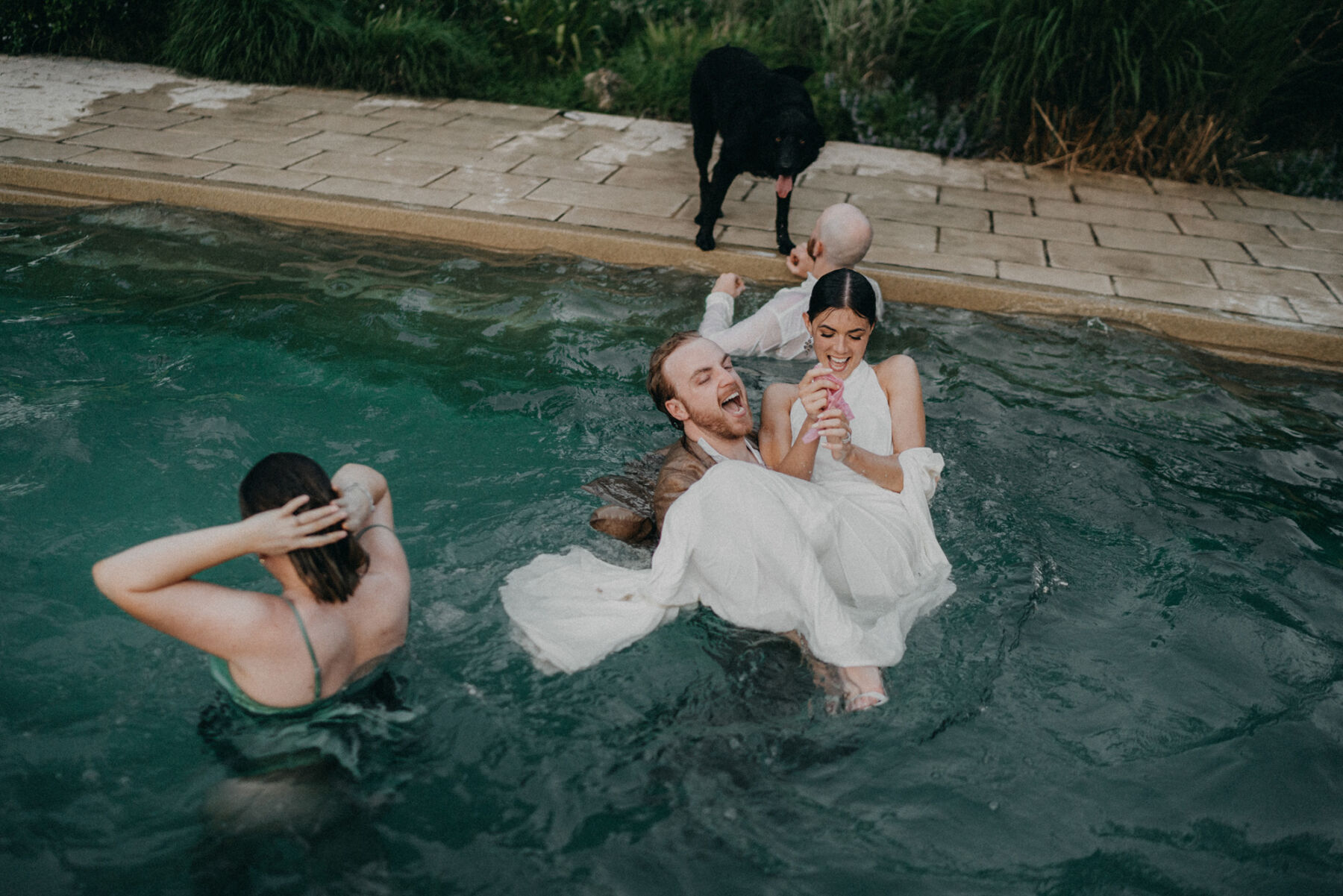 Bride and groom in a swimming pool