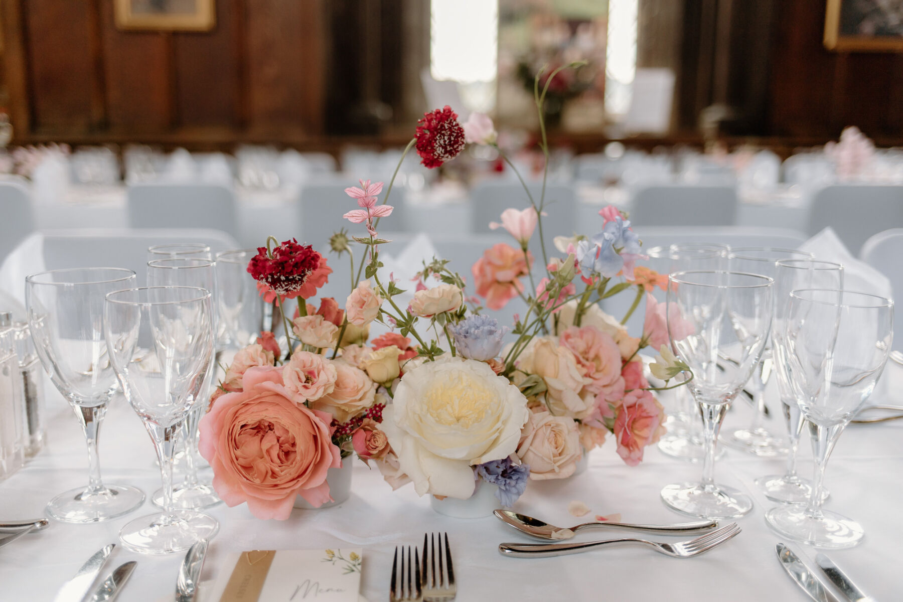 Livia in a Truvelle Bridal Gown for her Durham Castle Wedding With an Outdoor Summer Garden Ceremony 25 Elegant pastel wedding flowers table decor.