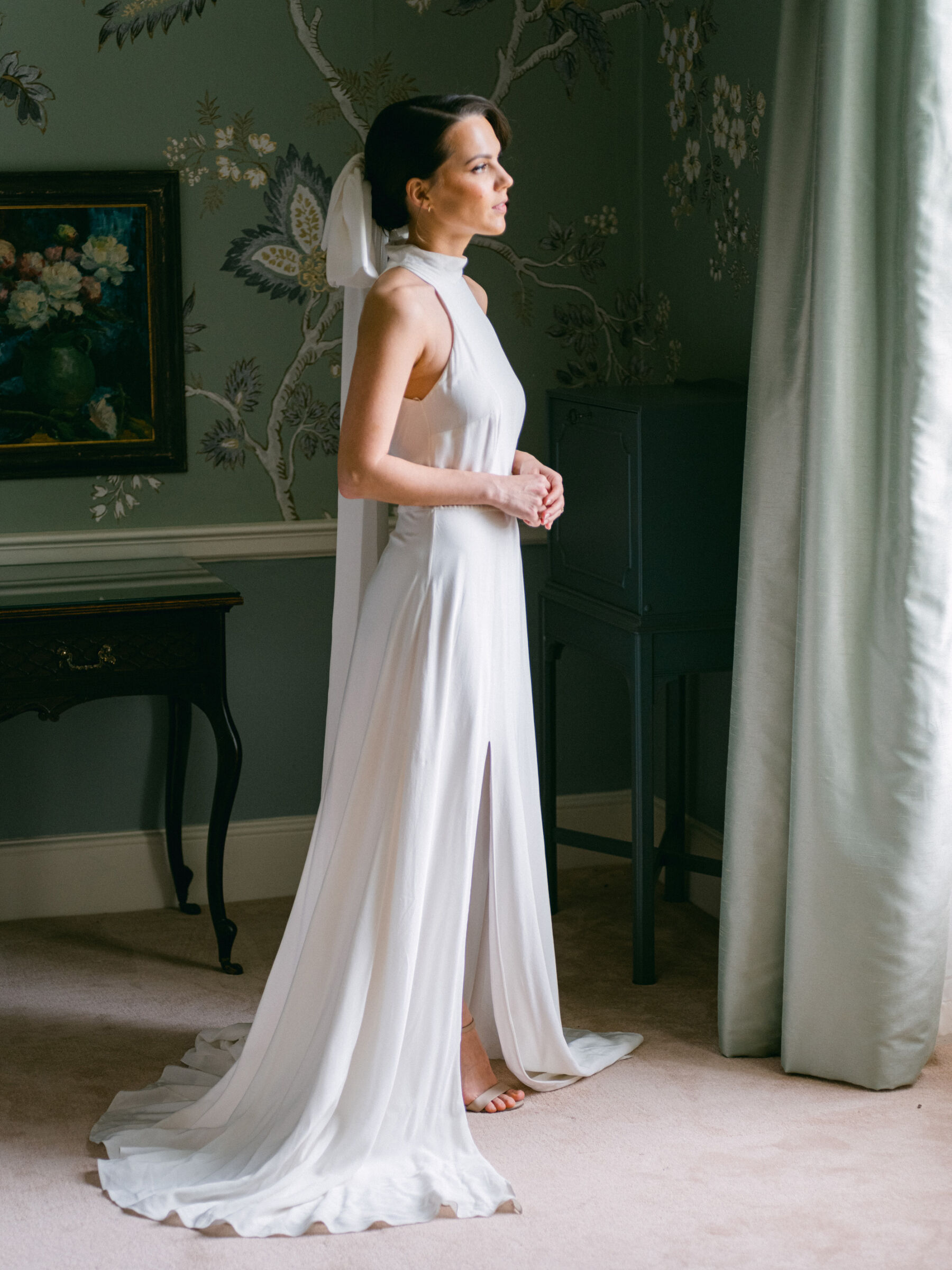 Celebrating Seasonal, British Grown Wedding Flowers With Flower & Fern at Findon Place 4 Elegant halterneck wedding dress and bow-veil.