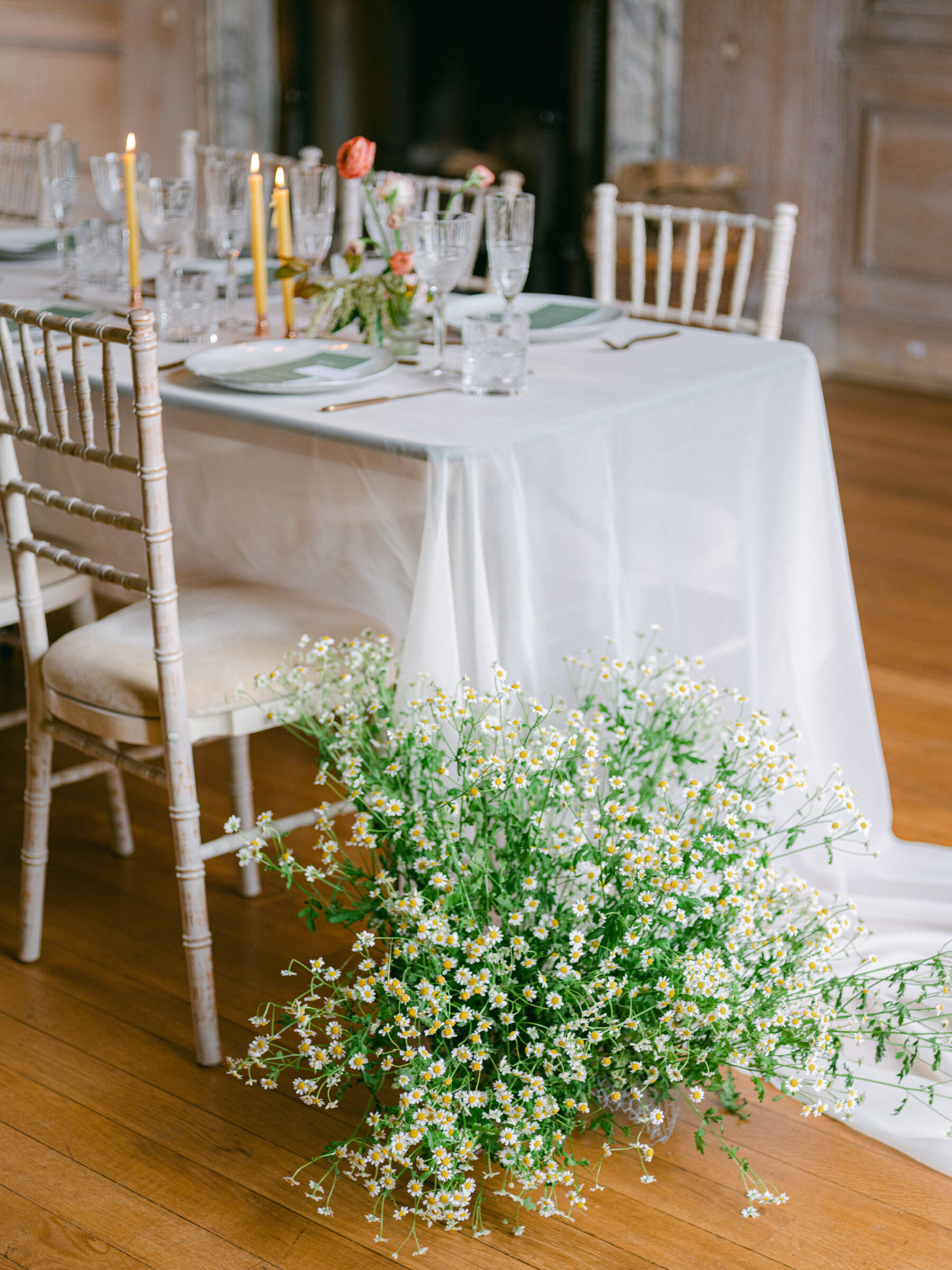 Celebrating Seasonal, British Grown Wedding Flowers With Flower & Fern at Findon Place 8 Floral decor at the foot of a wedding table. Chamomile daisies.