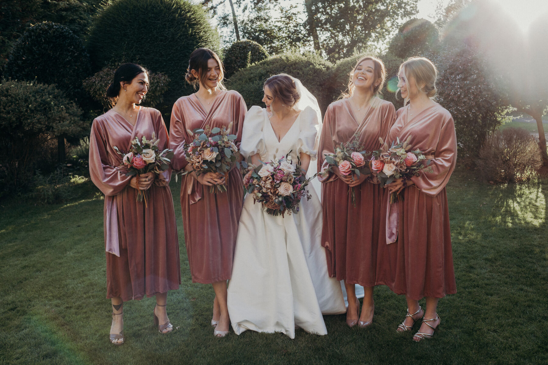 Bridesmaids in pink velvet dresses