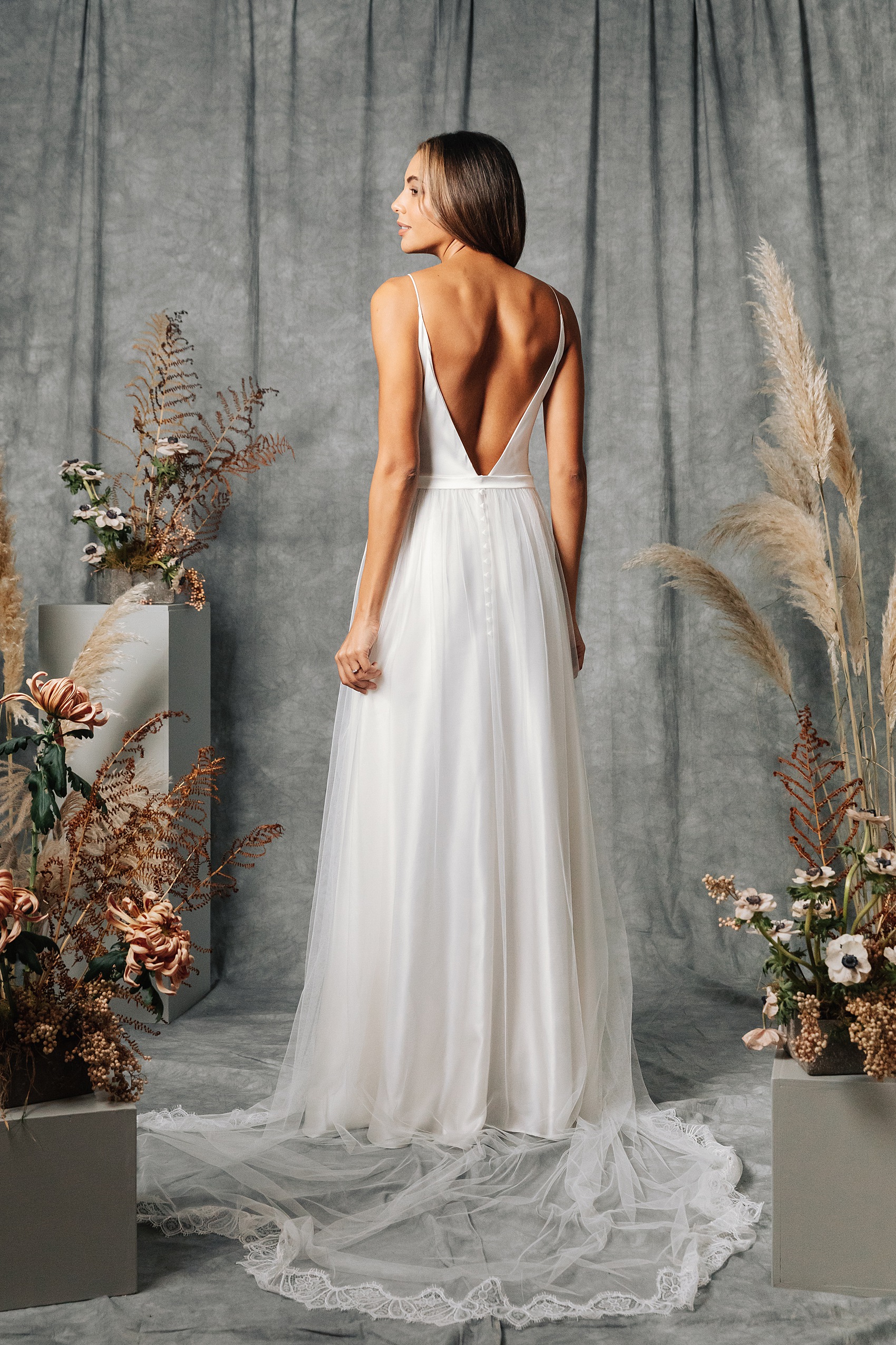 Elegant sustainable backless wedding dress by Kate Beaumont