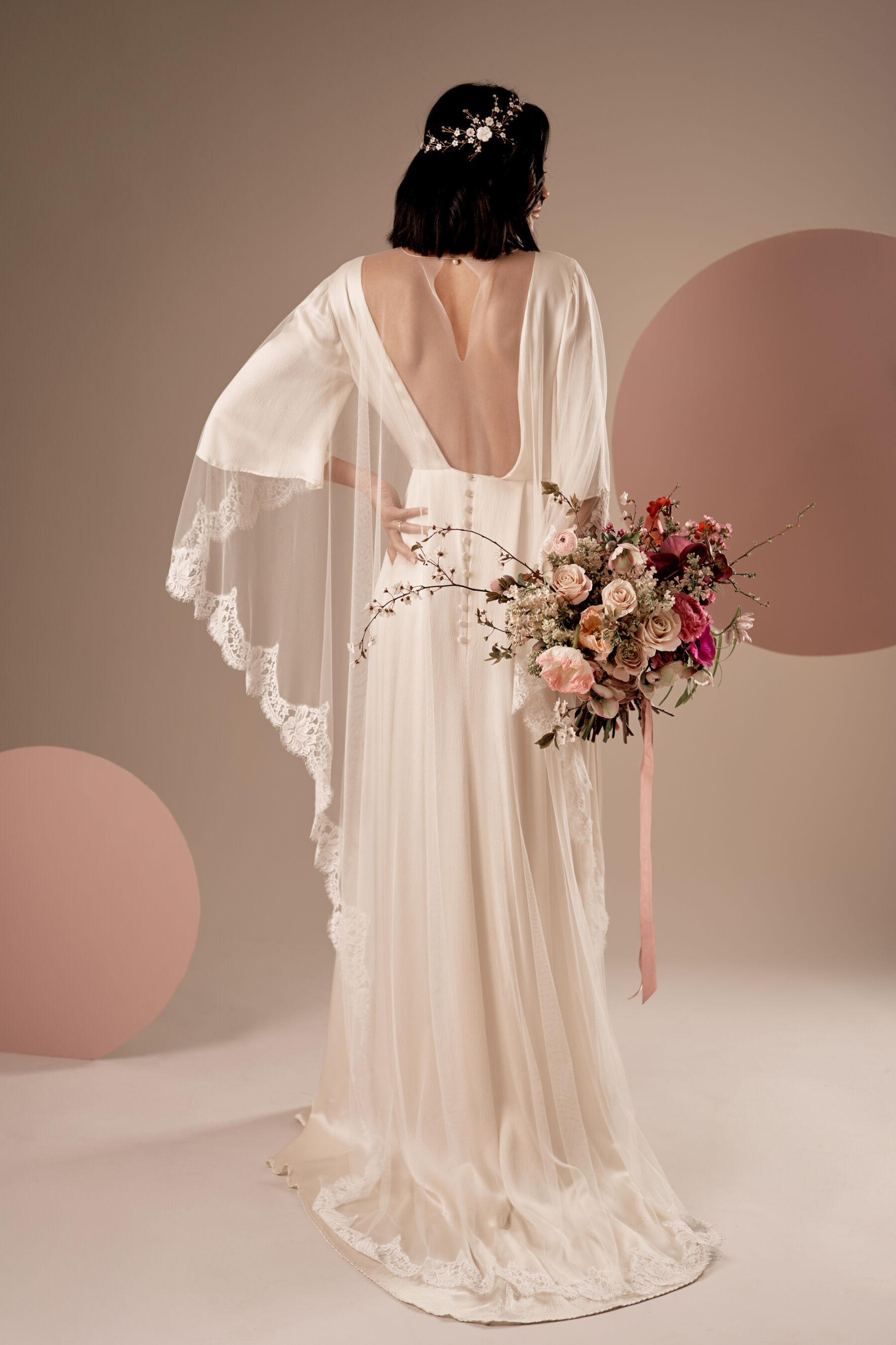 Elegant cream silk wedding dress by Kate Beaumont.