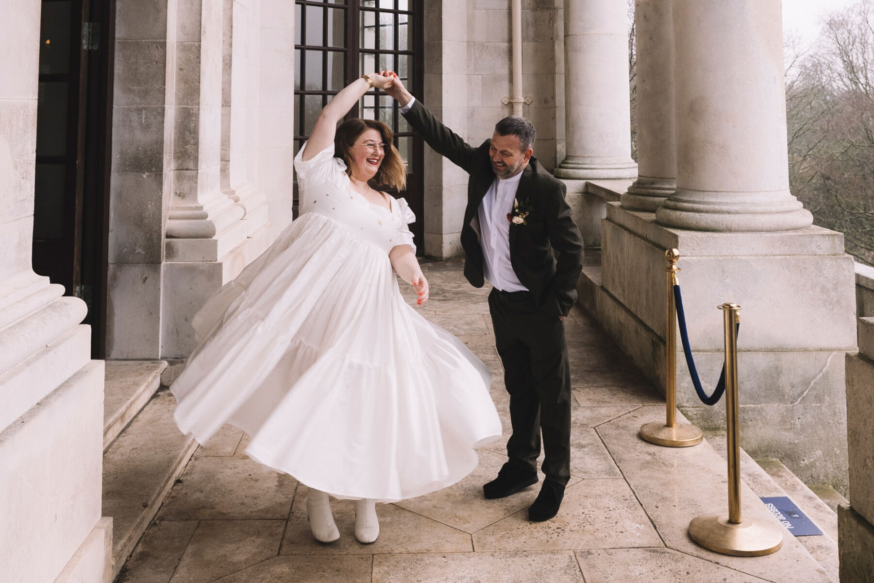 Bride twirling around in a Mary Benson wedding dress