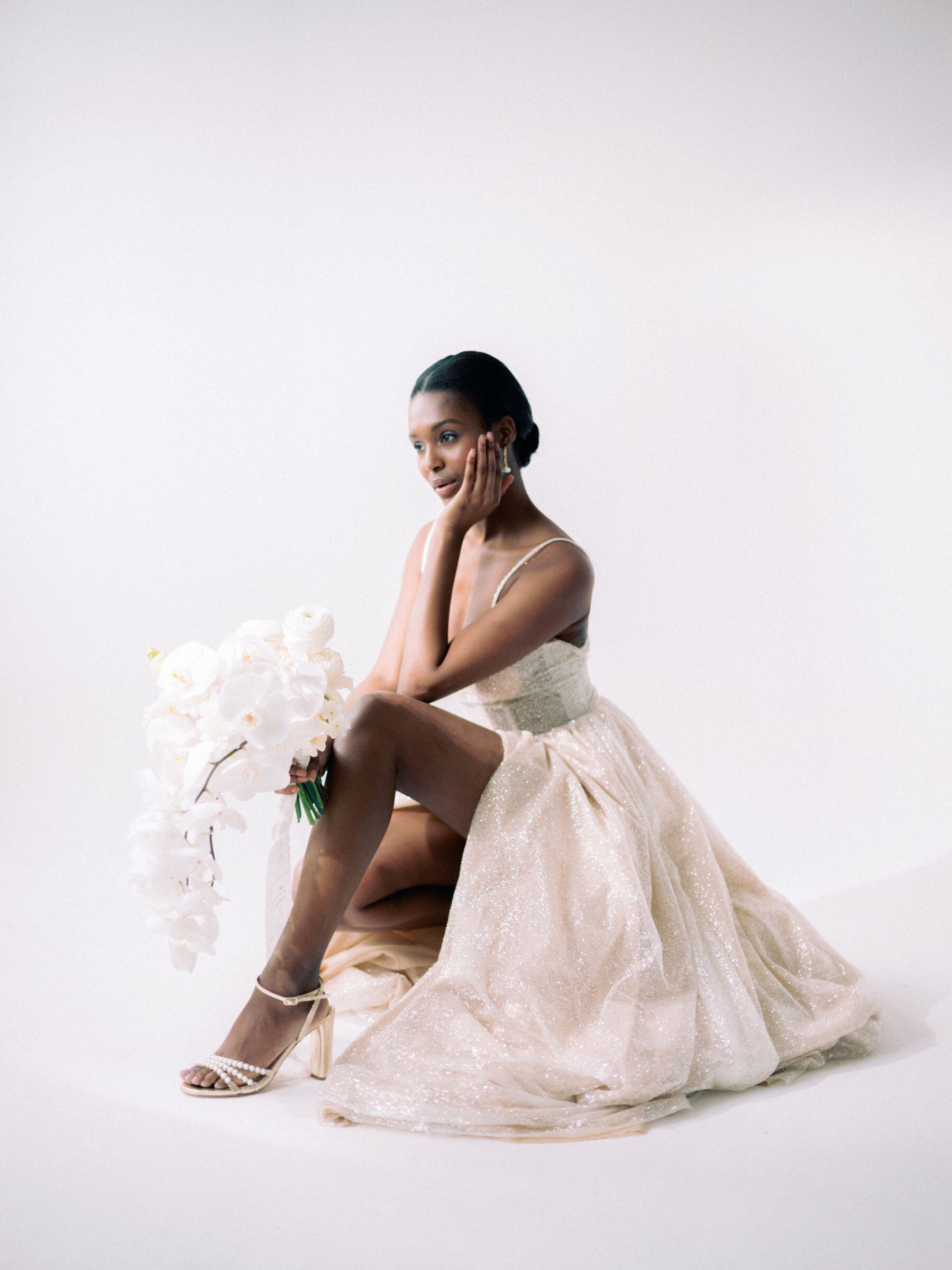 Black model wearing a Dotty Bridal wedding dress