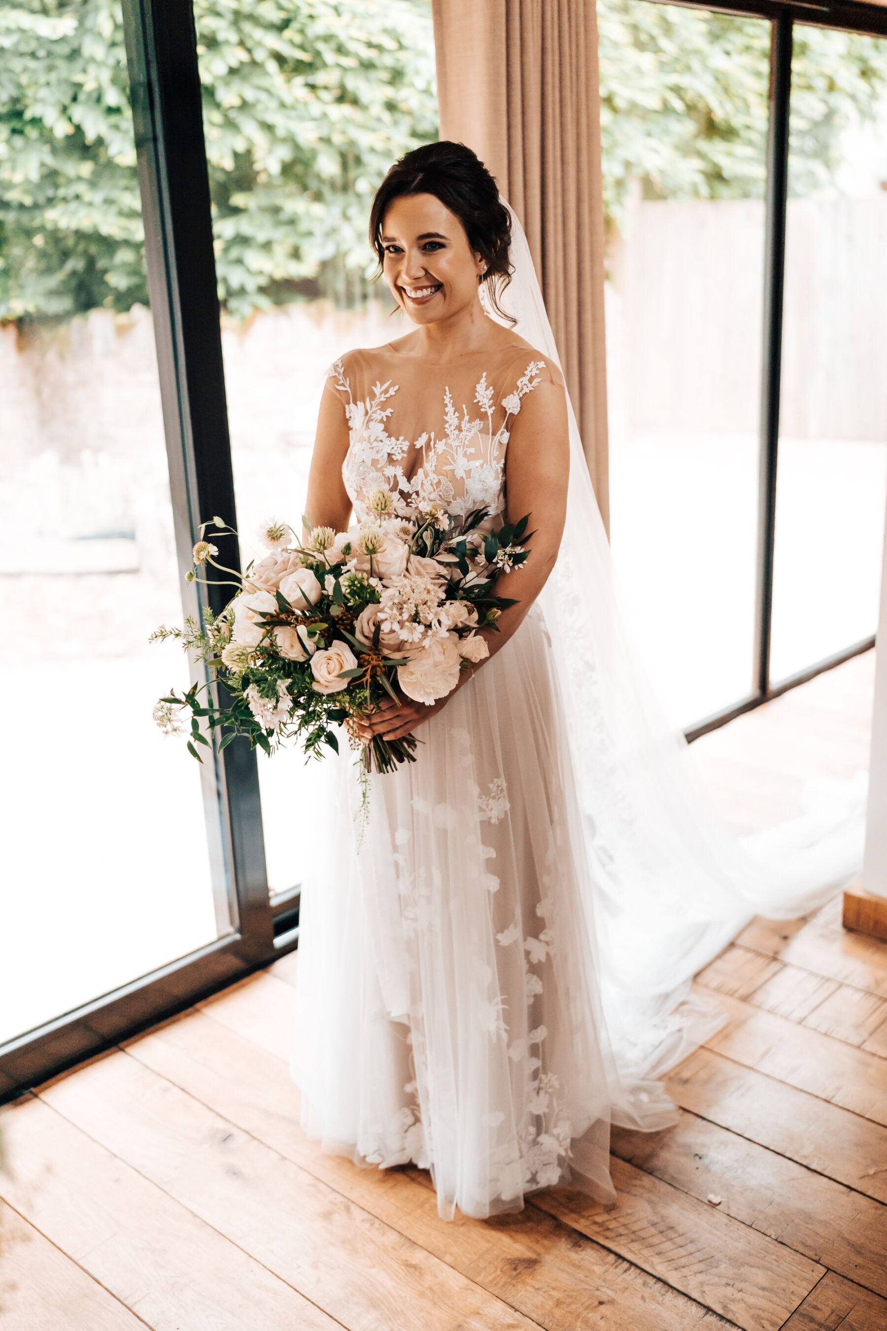 Bride in an Anna Kara dress at Tythe Barn wedding venue in the Cotswolds.